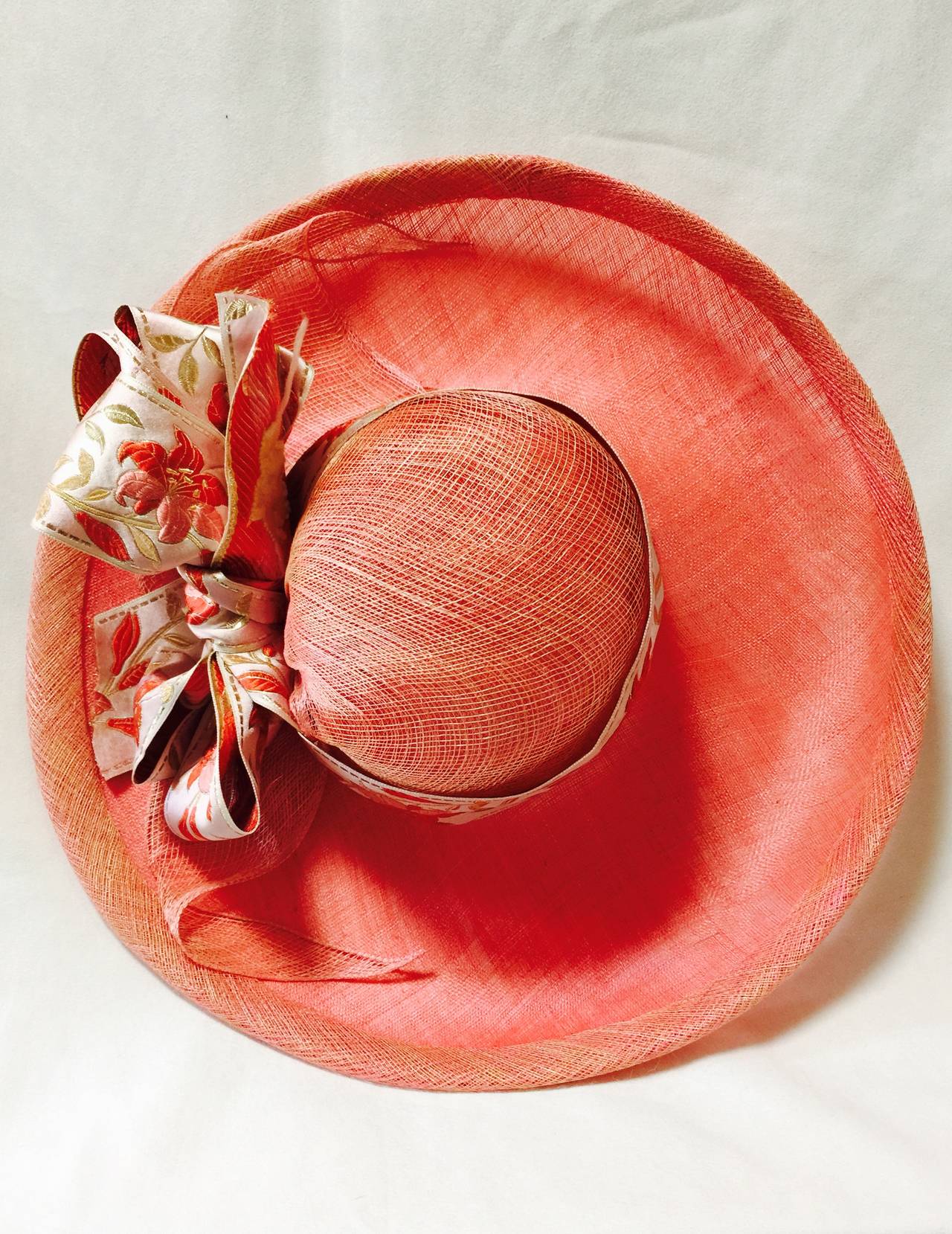 Marzi Natural Straw and Silk Wide Brim Hat is the ultimate in Italian millinery!  Trimmed in a most luxurious and glorious satin brocade ribbon and bow, hat has double layer at crown and substantial 1