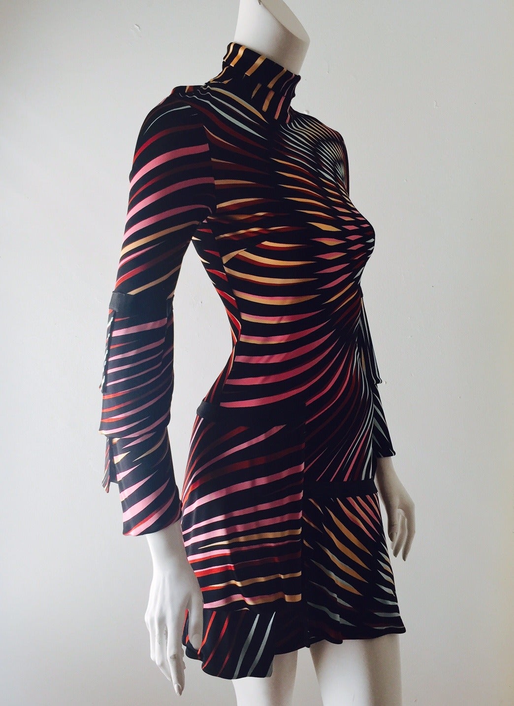 Print Turtleneck Long Dress is undeniably Missoni!  Advanced techniques abound...vibrant kaleidoscope print and flattering bias cut will garner praise from all admirers.  Solid black ribbon detail decorates the tiered, asymmetric bell sleeves and
