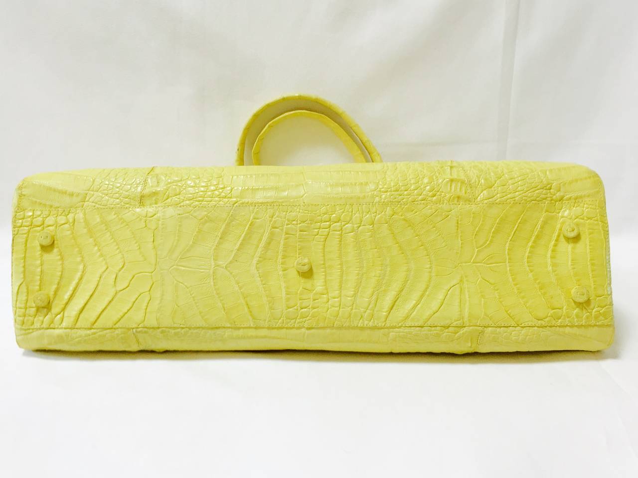Exquisite Citrus Yellow Crocodile Shoulder Bag shows why designs by Nancy Gonzalez have become highly collectible worldwide!  Features supple crocodile in a most delicious shade of yellow.  Double shoulder straps, magnetic closures and crocodile