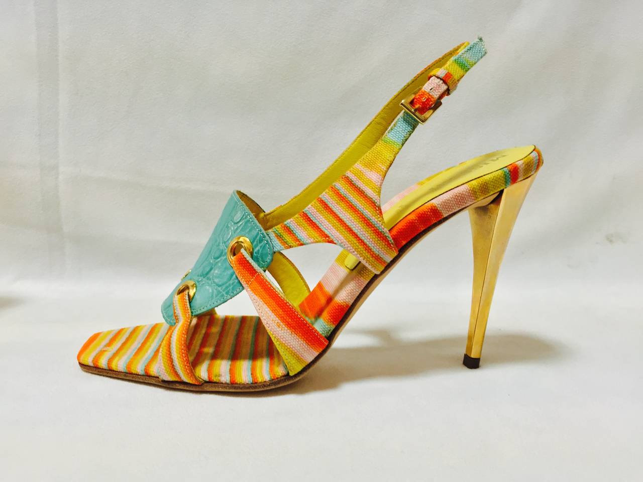 Mixed Media Strappy High Heel Sandals are true to the design aesthetic of Missoni!  Multicolor?  Yes!  Bands of turquoise, orange, yellow and pink fabric are perfectly complemented by turquoise crocodile embossed leather and citrus yellow smooth