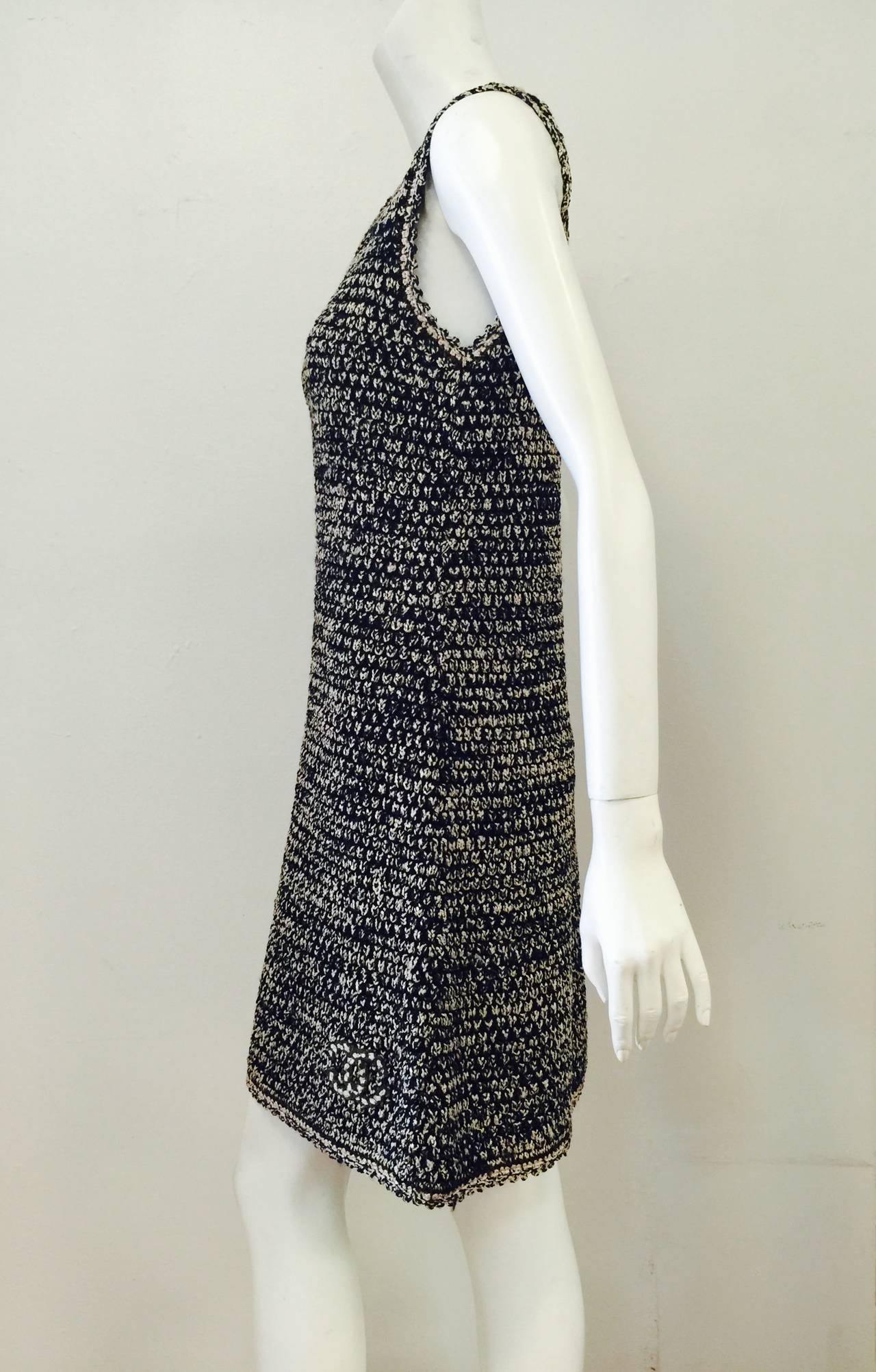 Sleeveless Multi Color Knit Shift Dress proves that Chanel is much more than boucle skirt suits!  Crafted in the early 1990s, this dress proves that chic can be comfortable.  Primarily navy and tan, this creation features relaxed fit, round