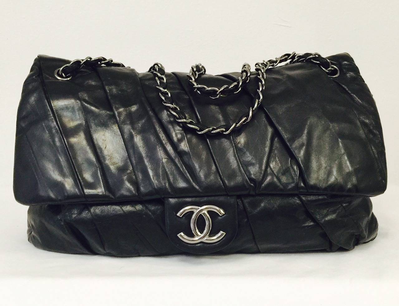 2009 Chanel Pleated Maxi Bag With Ruthenium Hardware is a must for all connoisseurs of all things Coco!   Ultra-luxurious lambskin is expertly gathered and pleated and creates an instant 