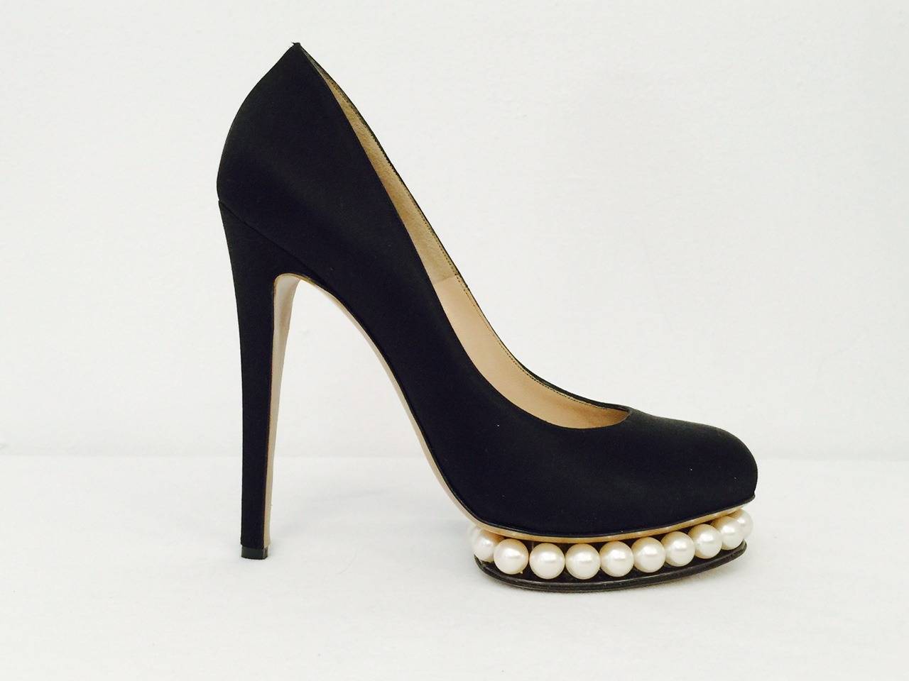 Walk on strings of pearls with every step in these New NIcholas Kirkwood Casati Pearl Platform Satin Pumps!   A sophisticated, memorable statement is guaranteed when wearing these awe inspiring shoes. Hand-crafted in Italy with elegant black satin