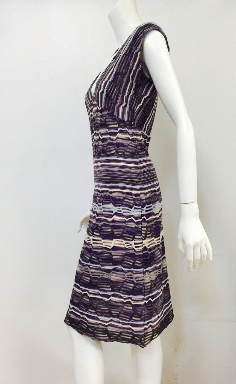 Knit Multi Color Cap Sleeve Dress is a must for connoisseurs of all things Missoni!  Perfect for travel, dress features v-neck and construction that celebrates Italian fabrication and styling.  Generous knee-length, a-line skirt is fit for a lady. 