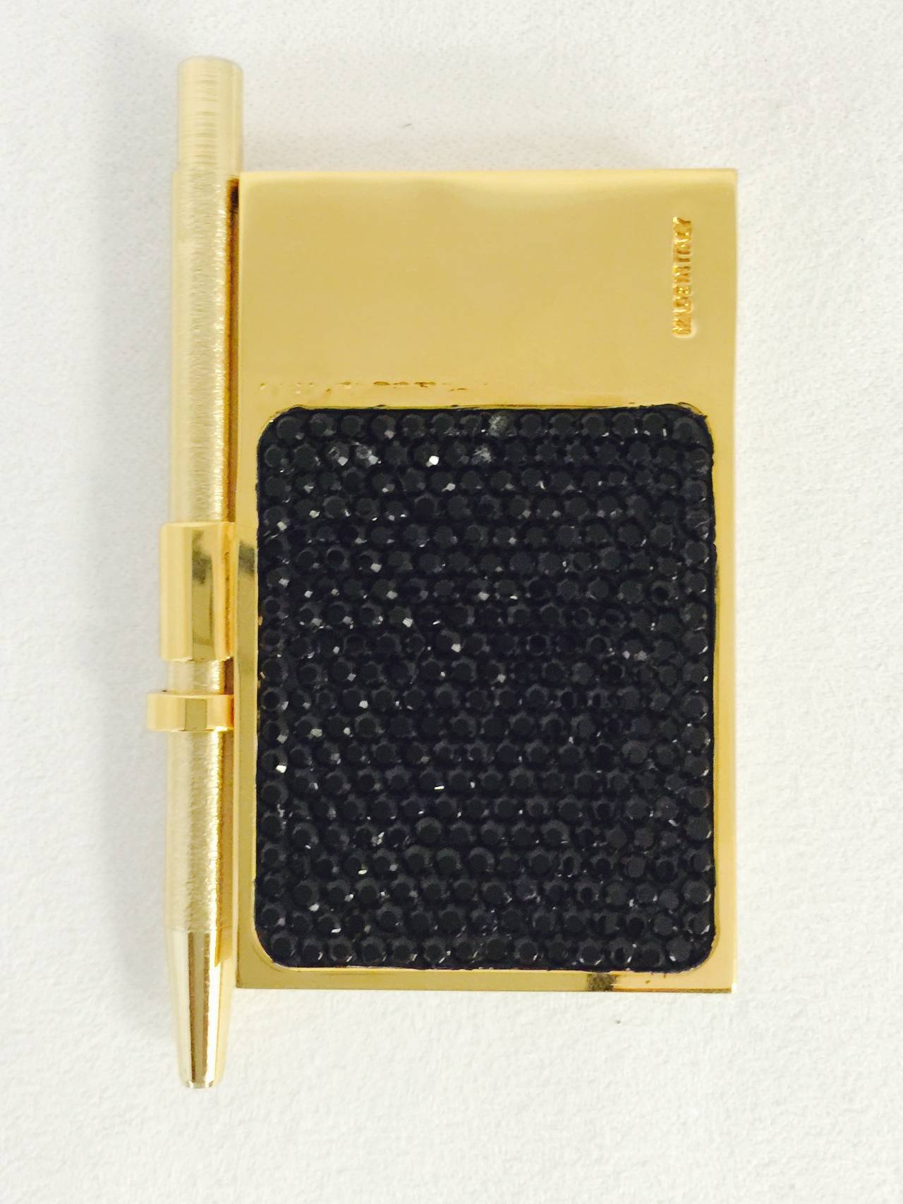 Take Note!  Only this Magnificent Swarovski Crystal Encrusted Mini Pad With Pen is worthy of Judith Leiber's minaudiere's or evening bags.  An ordinary pen and notepad simply will not suffice!  Features a glorious flower in full bloom on the front