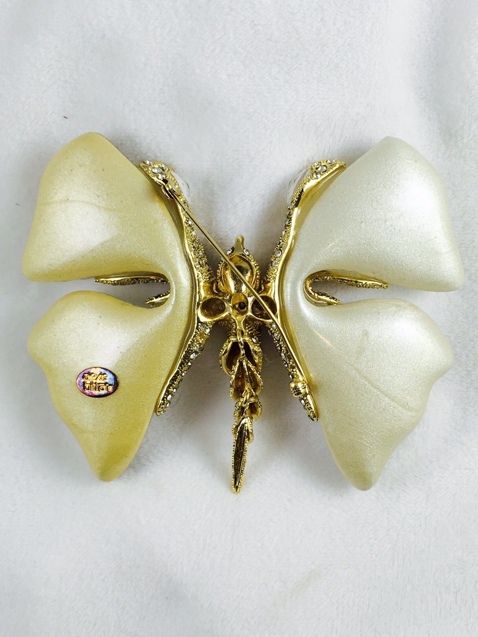 No wonder why pieces by Alexis Bittar are found in the Victoria and Albert Museum in London!  As in nature, no two are alike; each butterfly is individually hand sculpted and hand painted!  Features lucite, polished yellow golden metal,  pave