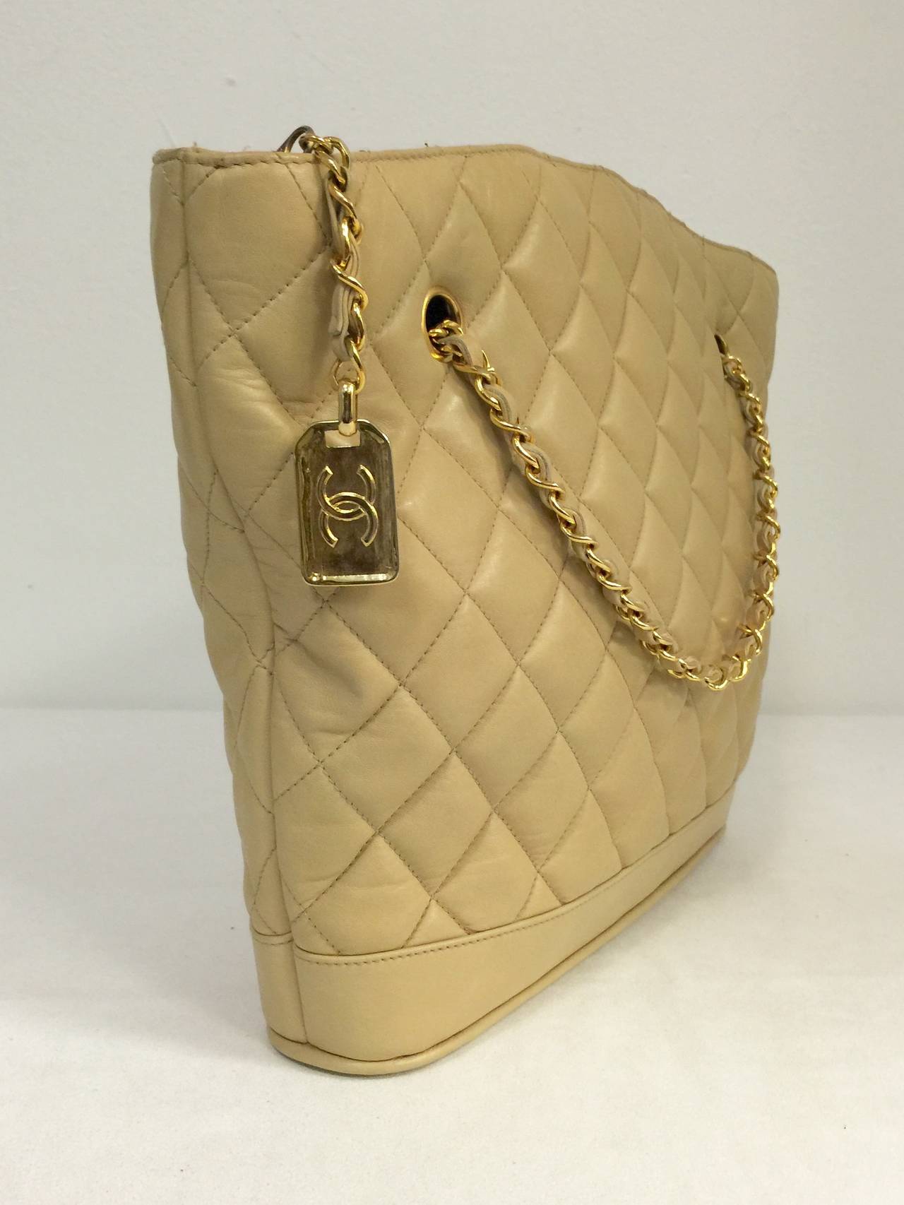 Vintage Chanel Tan Quilted Lambskin Shoulder Bag is highly prized.  Butter-soft tan lambskin, in signature stitched diamond pattern, has become as legendary as Coco herself!  Crafted between 1989 and 1991, bag features top zippered closure, double