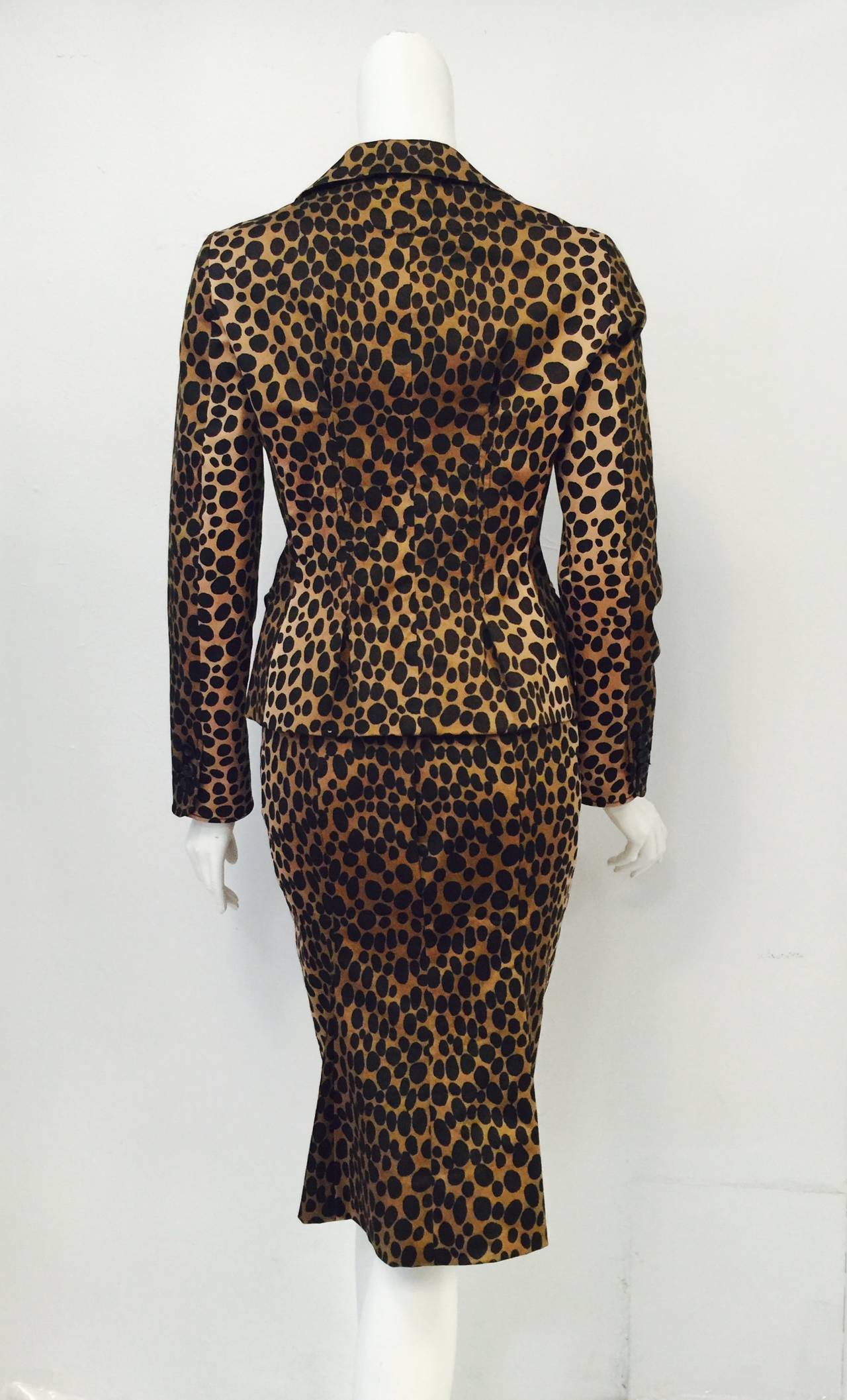 Moschino Cheap and Chic Cotton Stretch Skirt Suit is truly magnificent!  Features luxurious stretch fabric, exotic leopard print all over, fitted, peaked lapel jacket and knee length skirt.  Jacket has two flap pockets, three button front closure