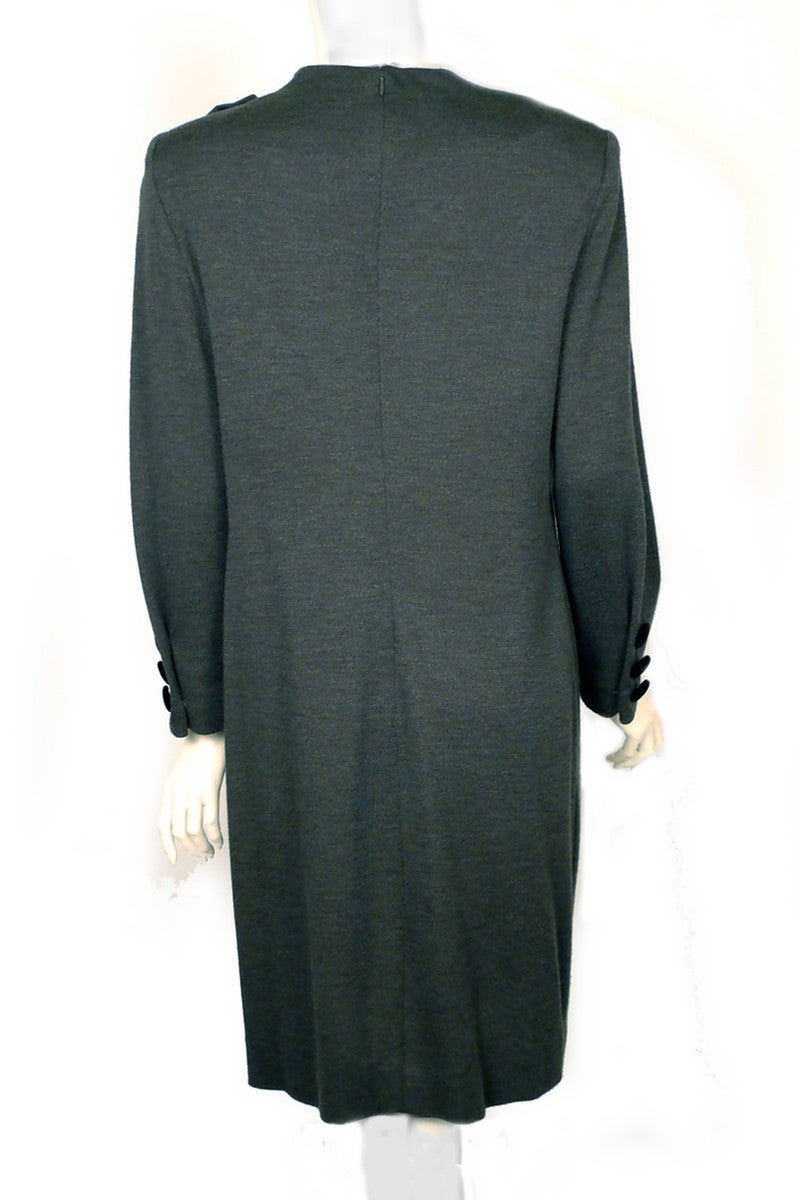 Classically elegant vintage dress by legendary couturier Pierre Balmain!  Long Sleeve grey wool dress is slightly draped at the neck and is gathered with velvet at the shoulder.  3 velvet buttons adorn each sleeve cuff.  Hidden back zipper. Simply