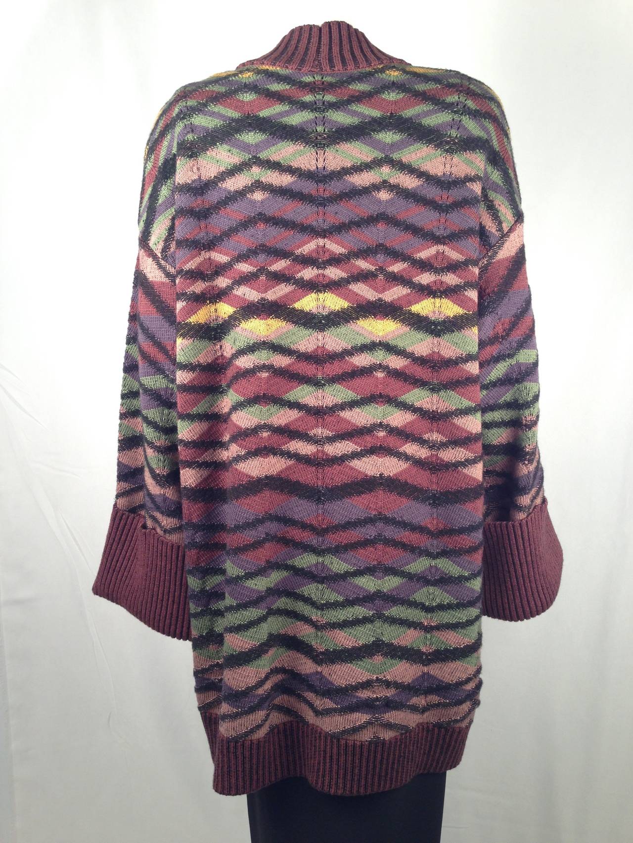Hard to believe that this luxurious sweater coat dates to the early 1980's!  Absolutely pristine, unworn condition belies its vintage status.  It even has tags!  Inimitable Missoni knit pattern is surrounded by generous, extra-deep ribbed cuffs,