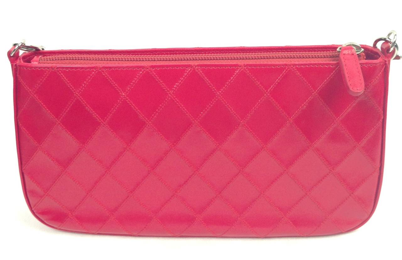 What a precious red handbag to go from day to evening.  With the infamous Chanel Cross-Stitching, this beauty is in impeccable condition and has a handle that will fit over the shoulder, but also detach to become a simple, classic clutch.  With