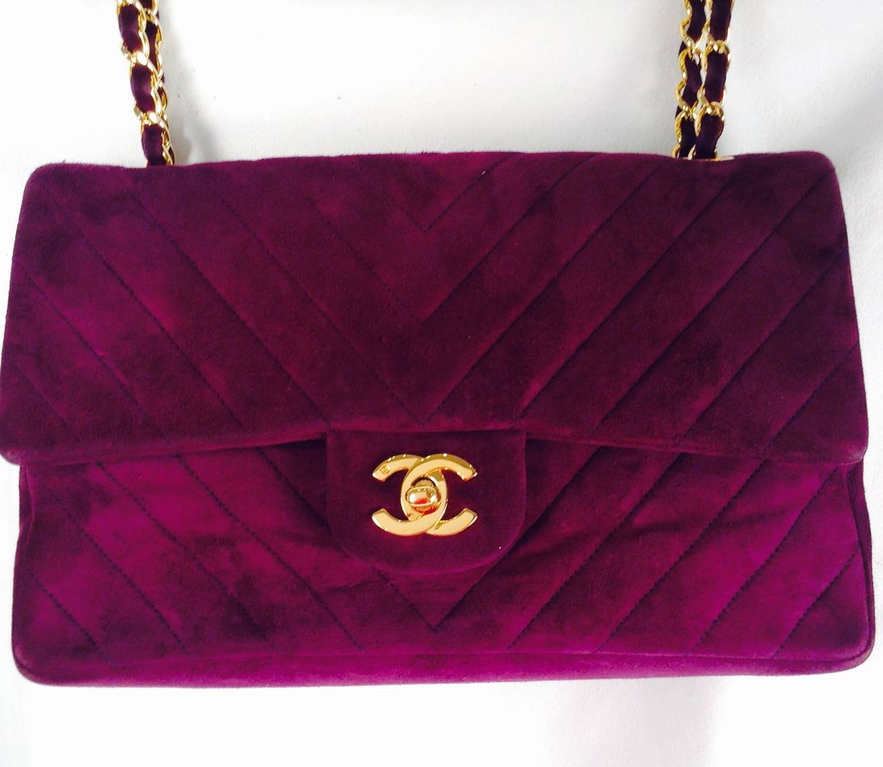 Vintage Chanel Chevron Quilted Double Flap Bag was crafted between 1989 and 1991 and is sure to please even the most discerning Chanelophile!  Exquisite plum, fit for any royal, is exalted in luxurious suede and leather.   It's all here..double