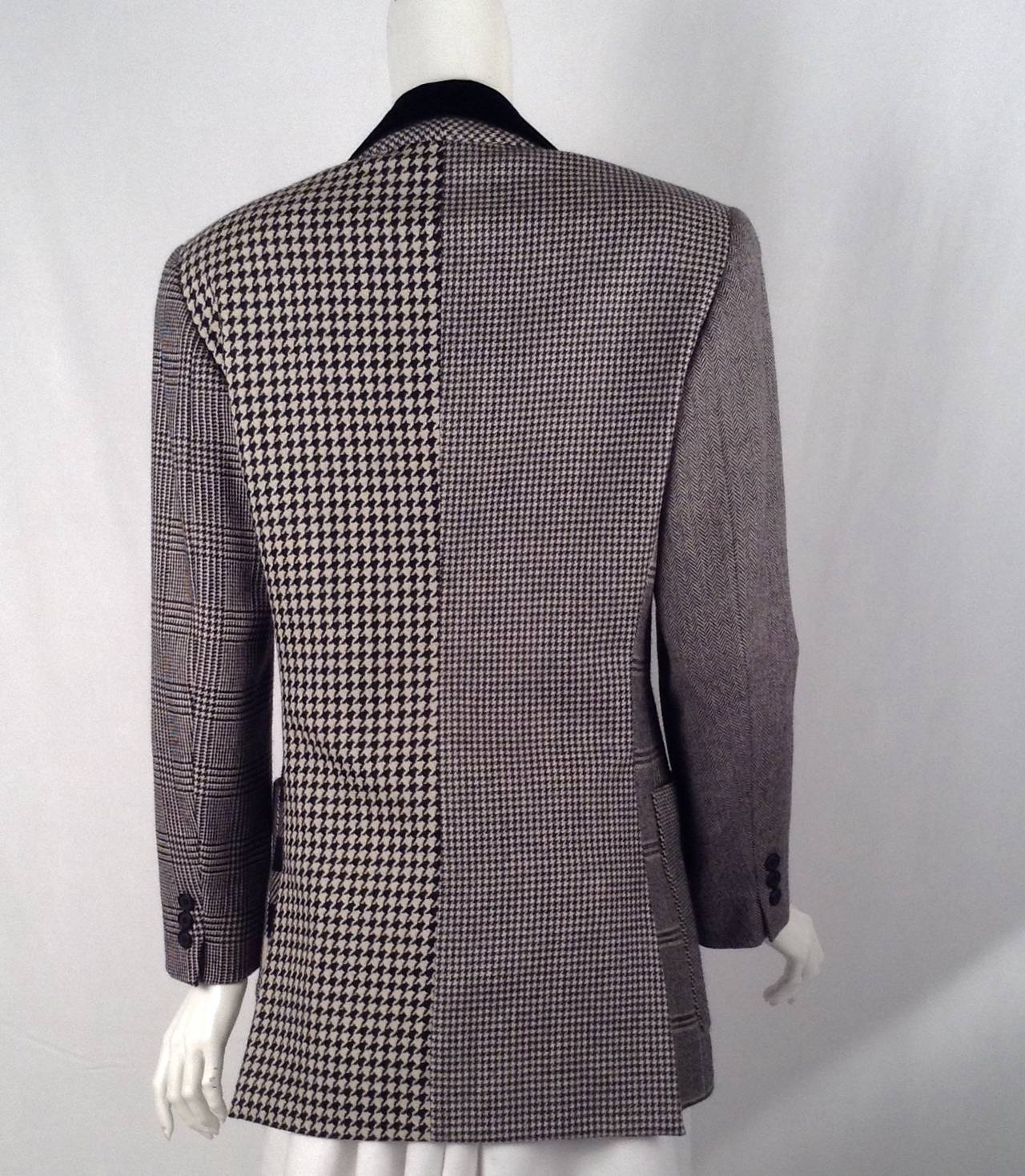 Visually stunning, classic wool jacket from the renowned Italian designers Domenico Dolce and Stefano Gabbana!  Jacket features black and white herringbone, houndstooth, plaid and zig-zag patterns.  Luxurious velvet Chesterfield collar completes the