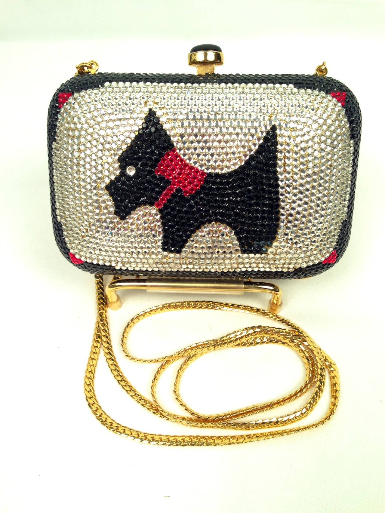 Walking the dog was never this glamorous!  Daniella Crystal Evening Bag is encrusted in black, clear and red crystals, 