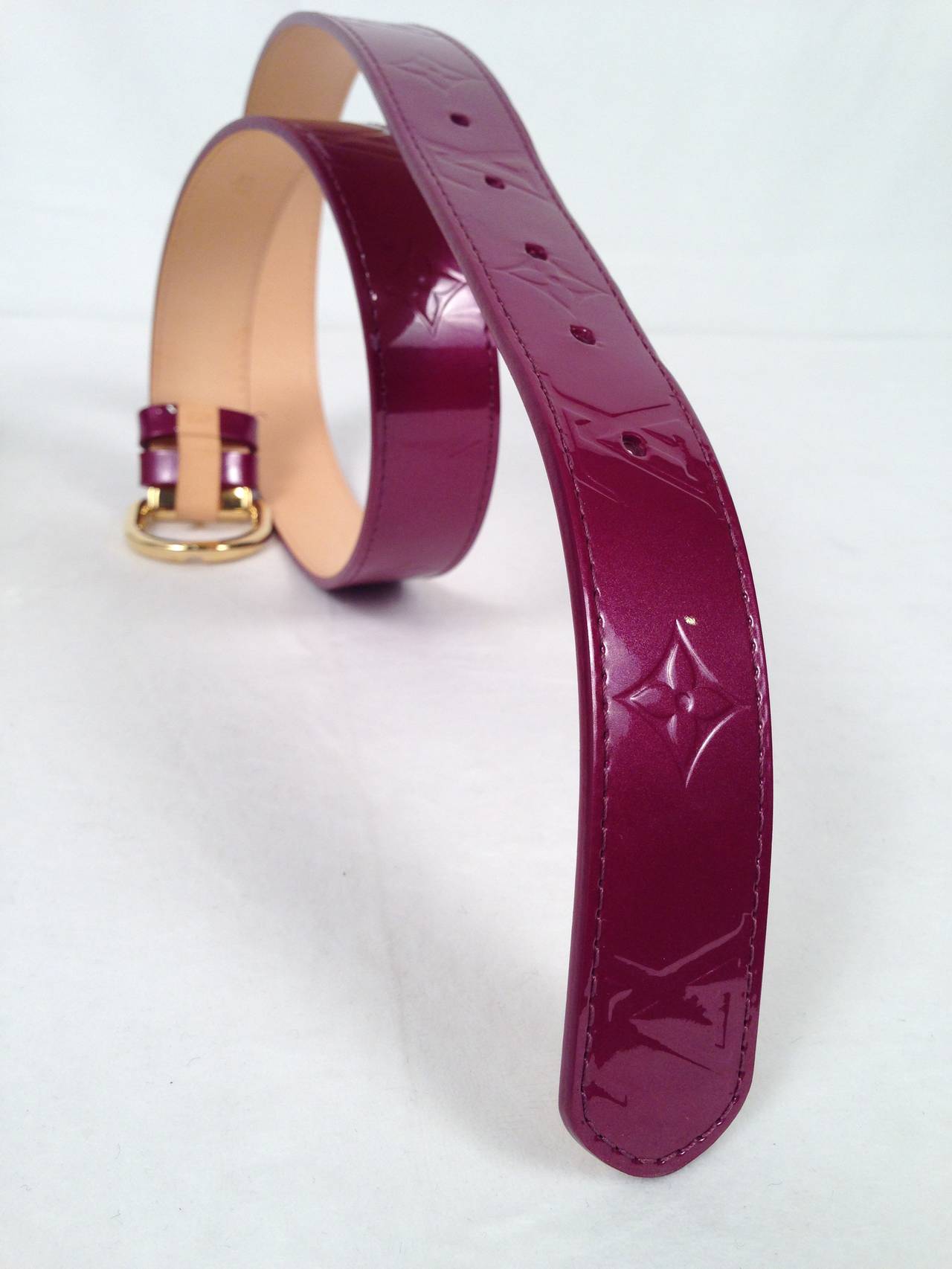Cinch your waist with luxurious Louis Vuitton Vernis belt!  Purple Monogram embossed patent leather belt features gold hardware with Louis Vuitton logo.  Color actually changes in different light!  Original box included.  Made in France.