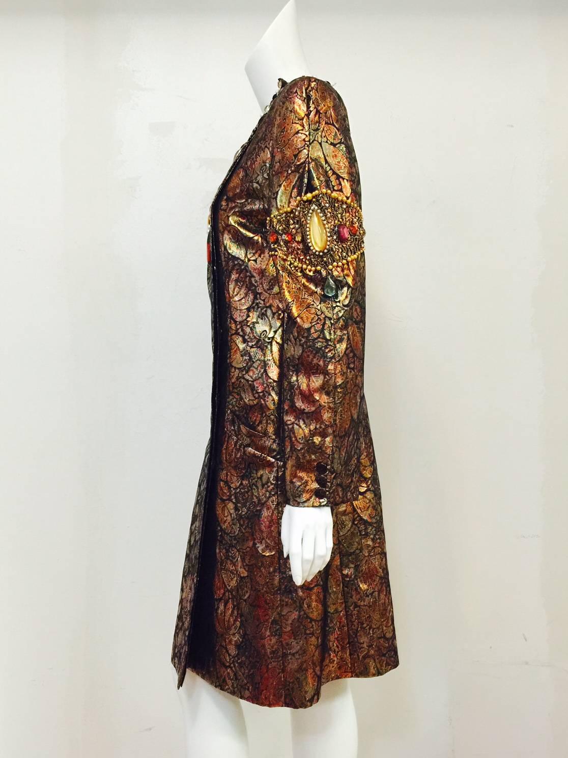 A most memorable entrance is guaranteed when wearing this incredible vintage confection from the Italian house Krizia!  Coat dress features ultra luxurious metallic silk brocade fabric in colors ranging from gold to bronze to copper!  Iridescent and