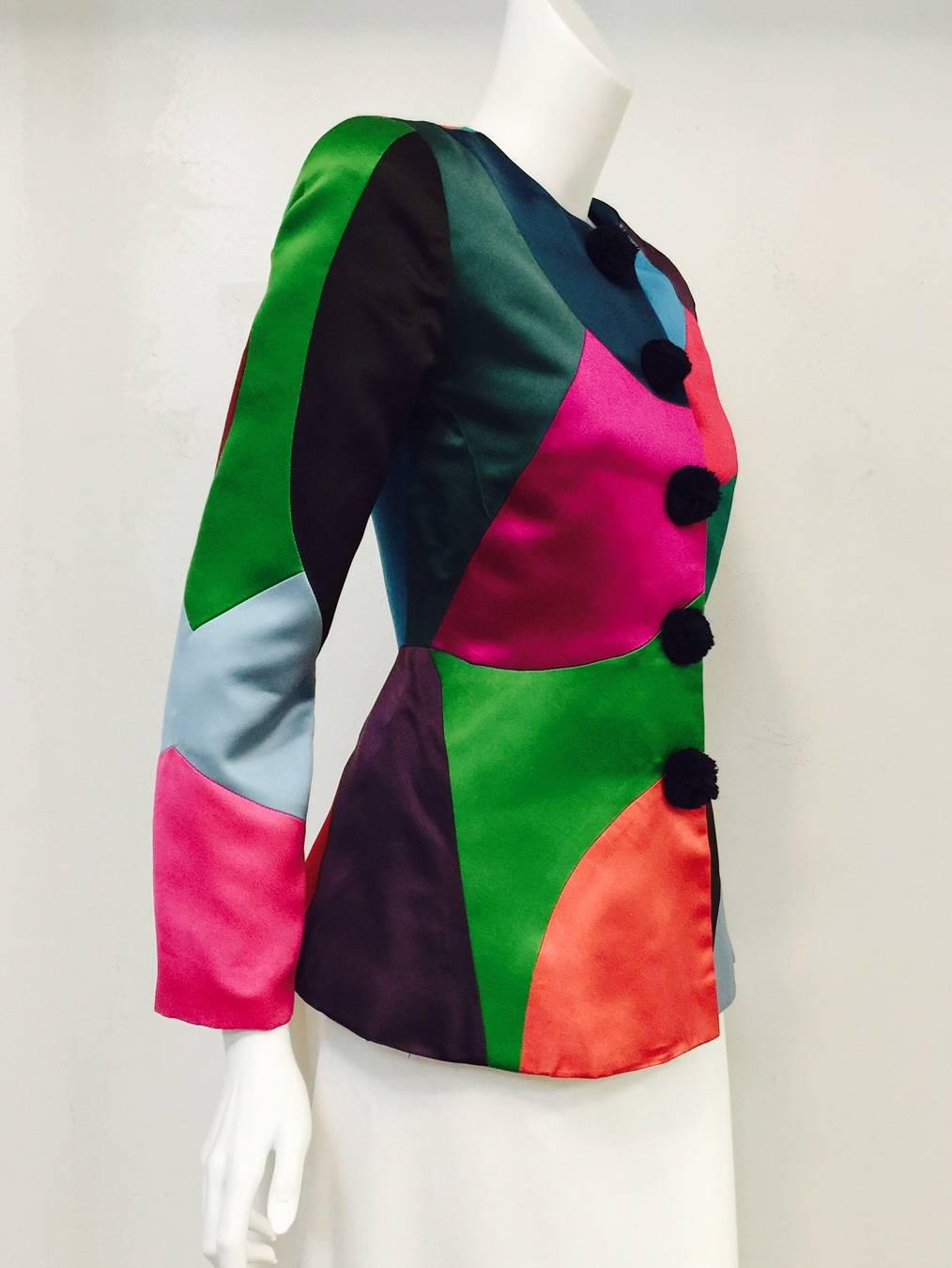 Make an unforgettable entrance in this Vintage Oscar de la Renta fitted Color Blocked Satin Jacket!  Clearly influenced by harlequin attire, collarless jacket is expertly crafted from ultra-luxurious satin "patches" in vibrant colors