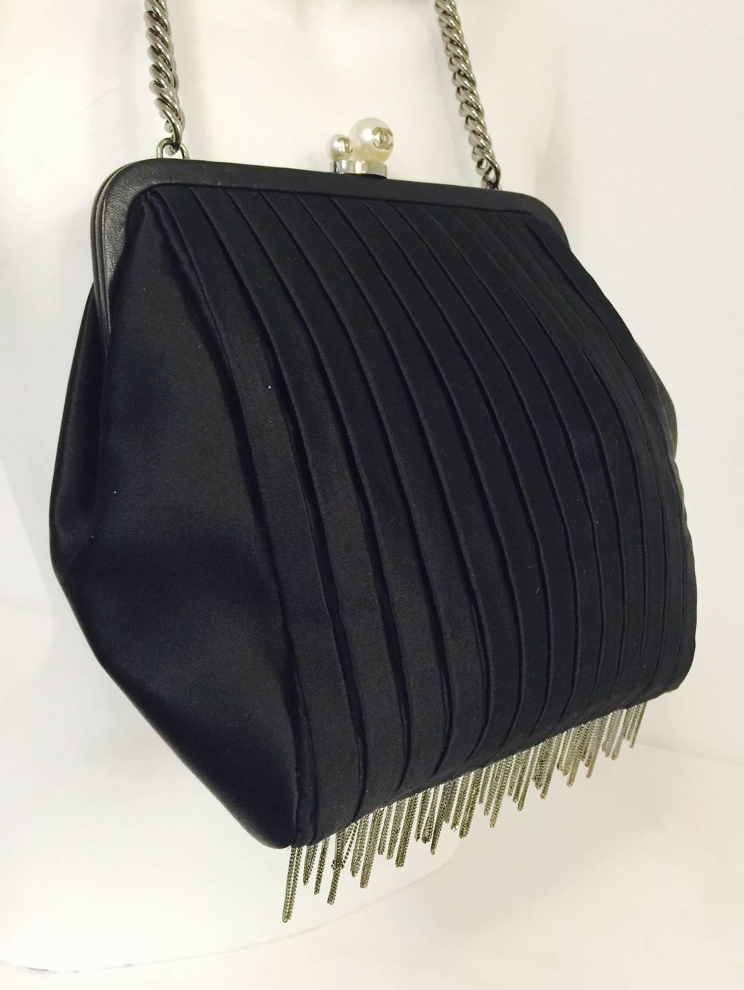 Crafted between 2006 and 2008, this Limited Edition Chanel Satin Vertical Pleated Satin Evening Bag is highly coveted by connoisseurs and collectors of all things Coco!  Features satin vertical pleats,frame top, bijoux dark silver tone chain and