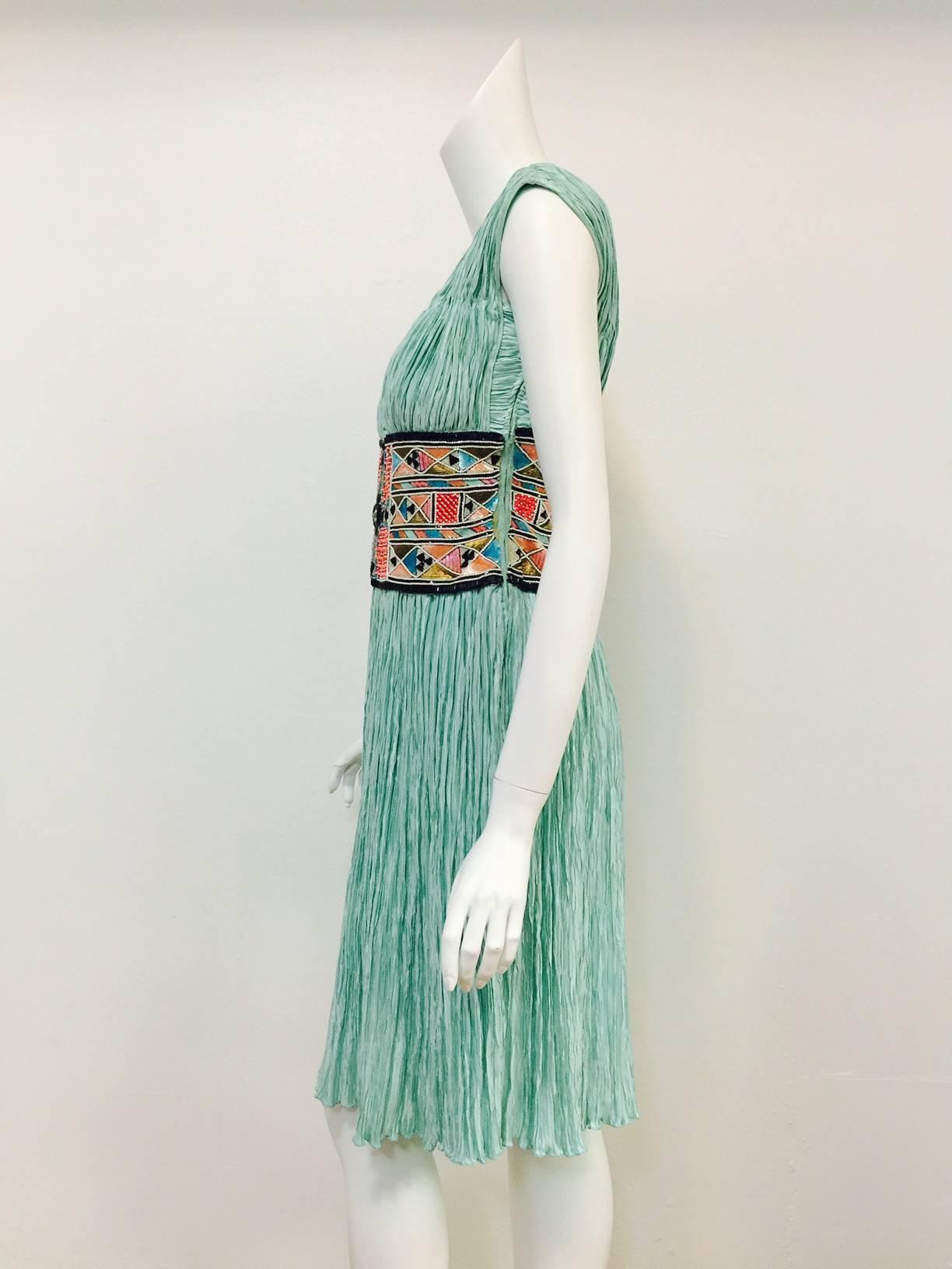 Vintage Embroidered Mint Marii Pleated Dress is a must for any connoisseur of Mary McFadden Couture!  Evoking the Goddesses of Greece, this classic design is made special through the use of McFadden's patented 