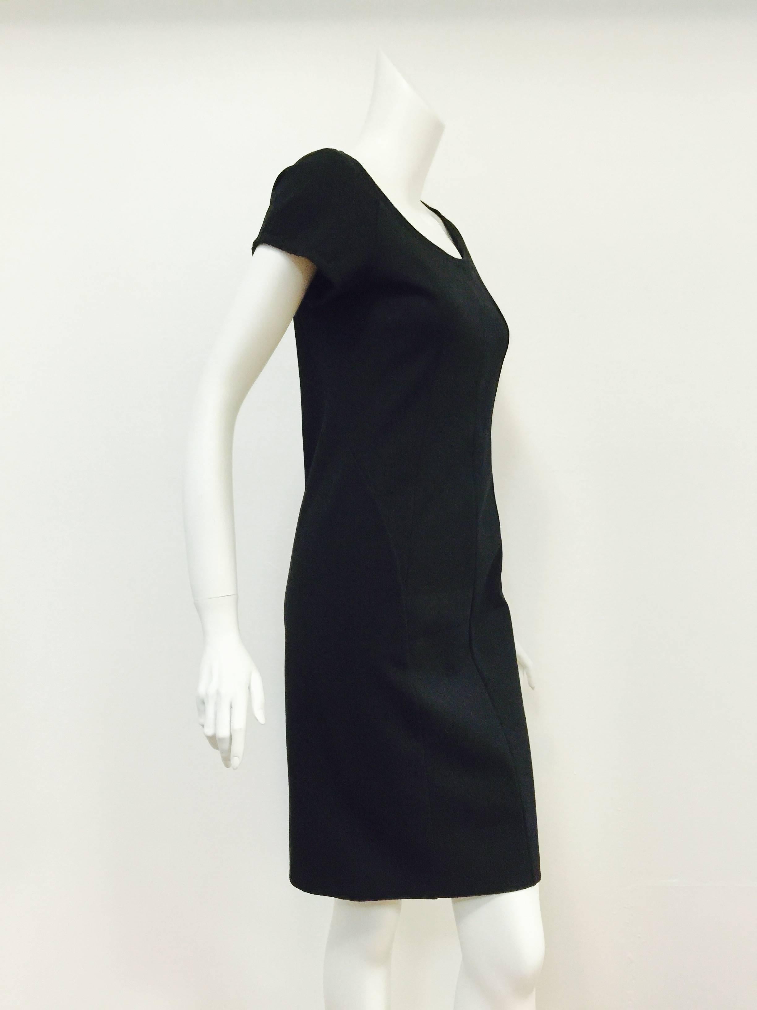 This Prada black sheath is a must for the seasoned fashionable traveler!  Always in style, this dress is expertly crafted from panels of ultra-luxurious stretch material that 