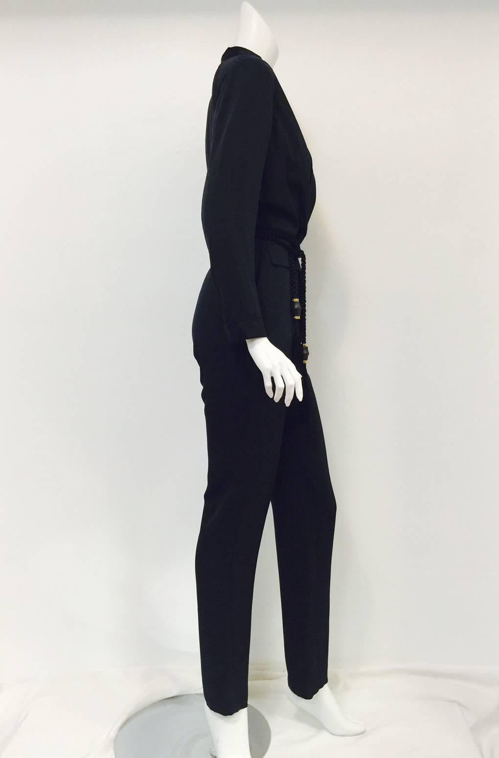Black Silk Tuxedo Jumpsuit  is a must for any connoisseur of the Gucci that Tom Ford built!  Features ultra-luxurious silk with satin tuxedo collar, breast pocket and cuffs!  Two flap pockets complete the look.  The piece de resistance?  A