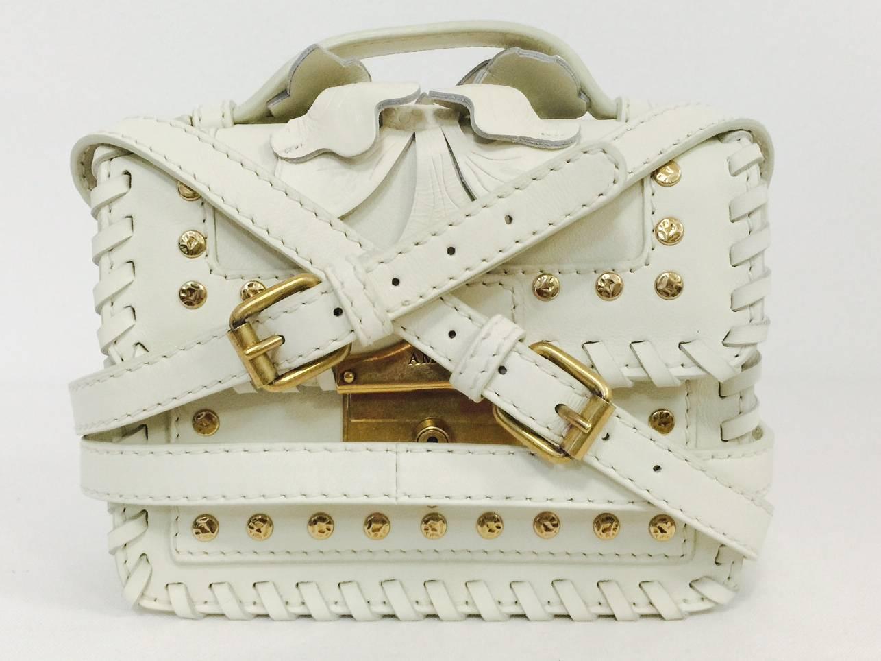  White Leather Crossbody Bag With Leaf Appliques and Studs is a must for connoisseurs of all things Alexander McQueen!  Features a structured design finished with extensive whipstitching.  Brass hardware includes hammered studs and push-lock