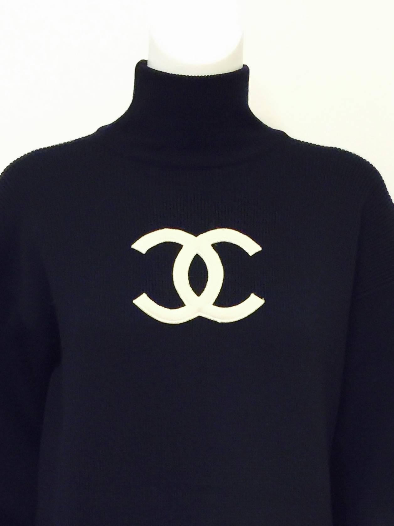 Chanel Navy Blue Wool Varsity Pullover Sweater Dress is rare and highly coveted by collectors of all things Coco!  Reminiscent of the sweaters that star athletes proudly wore at prestigious colleges and universities during the first half of the 20th