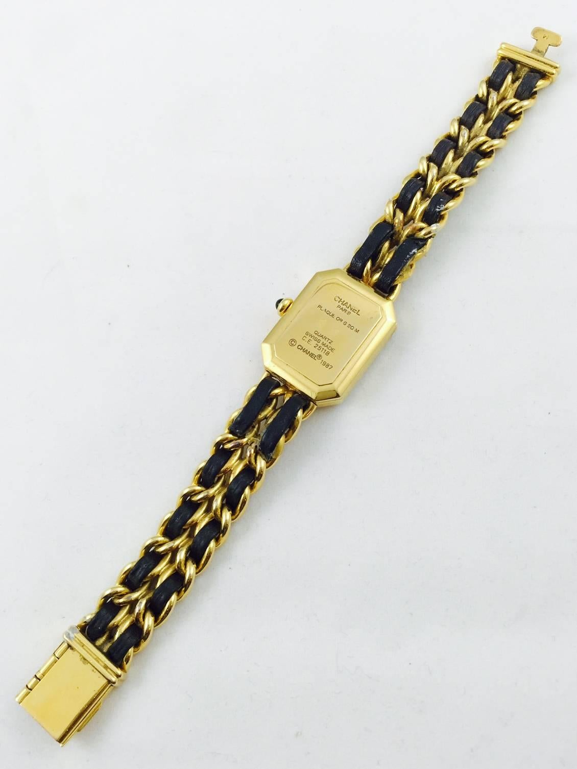 Gold Tone Premiere Watch is Chanel's longest selling and highly coveted timepiece.  No wonder!  Features white detail against matte black face, faceted sapphire glass crystal, and elliptical hands.  Gold-filled case, case back, crown base, clasp and