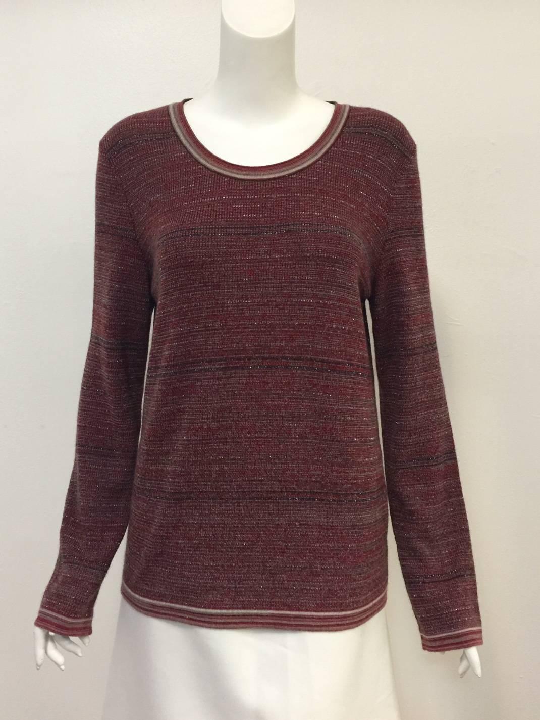 Chanel Cashmere Blend Pullover proves that cozy can be chic!  Features horizontal stripes ranging in color from burgundy to claret  to charcoal and metallic silver, long sleeves, generous proportions and round, banded neckline.  Keyhole rear closure