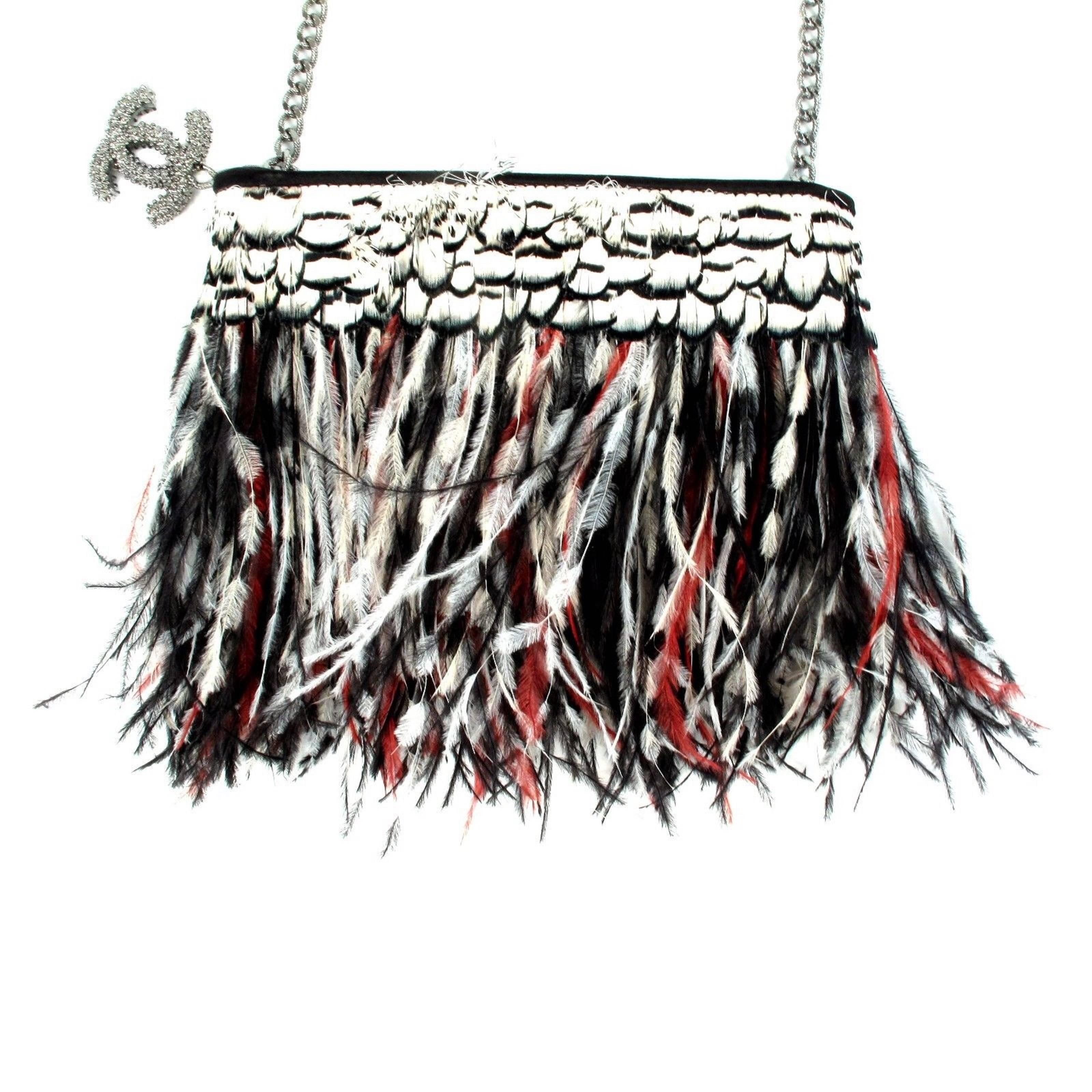 Take Flight!  Introduced during the Chanel Spring 2011 Runway show, this bag has become a highly-coveted collectible!  Classic diamond quilted lambskin body is embellished all over with fabulous ostrich feathers in shades of red, white and black!  