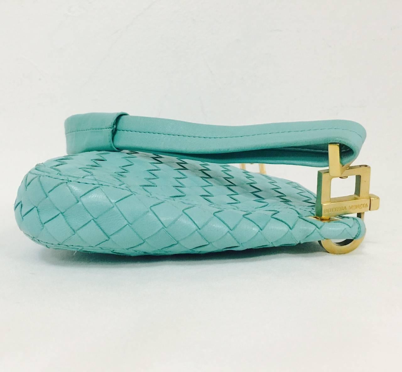 No wonder Bottega Veneta is a favorite of society ladies, fashionistas, and celebrities alike! This Mint Blue/ Green shoulder bag features signature 