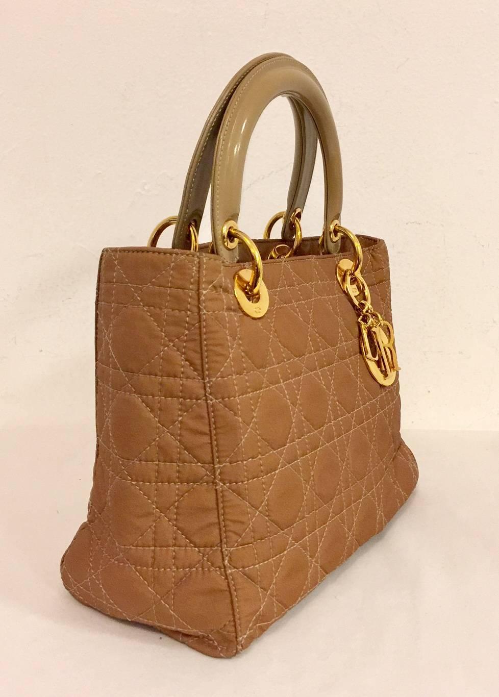 Christian Dior Camel Nylon Lady Dior MM Hand Bag is highly desired by royals and celebrities alike. More than merely an 