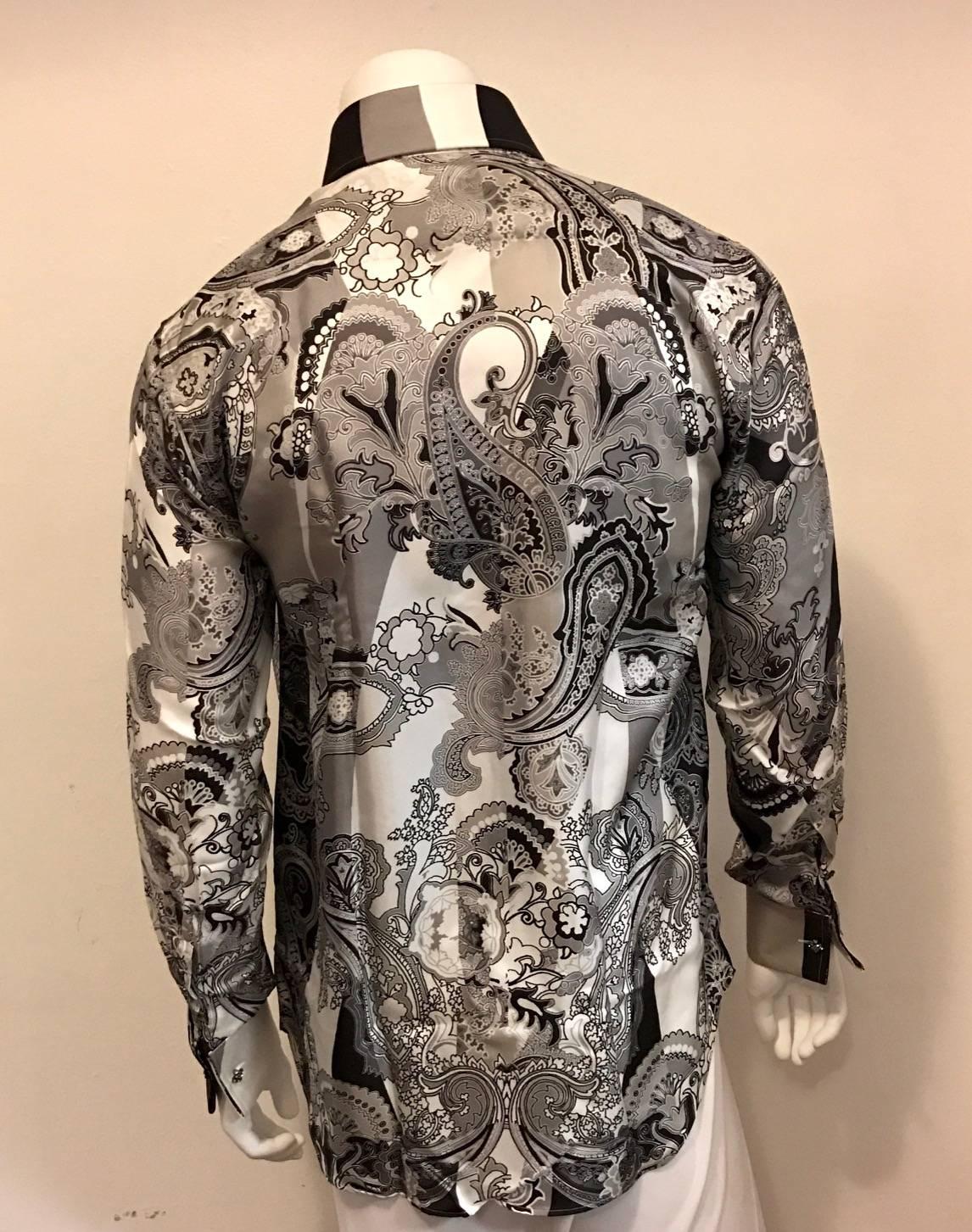 Dress like a billionaire in this soft silk shirt in shades of grey and white paisley.  Crystal buttons in amethyst grace the shirt front and french collar and removable cufflinks.  There are two spare buttons on inside seam. A stunningly rich