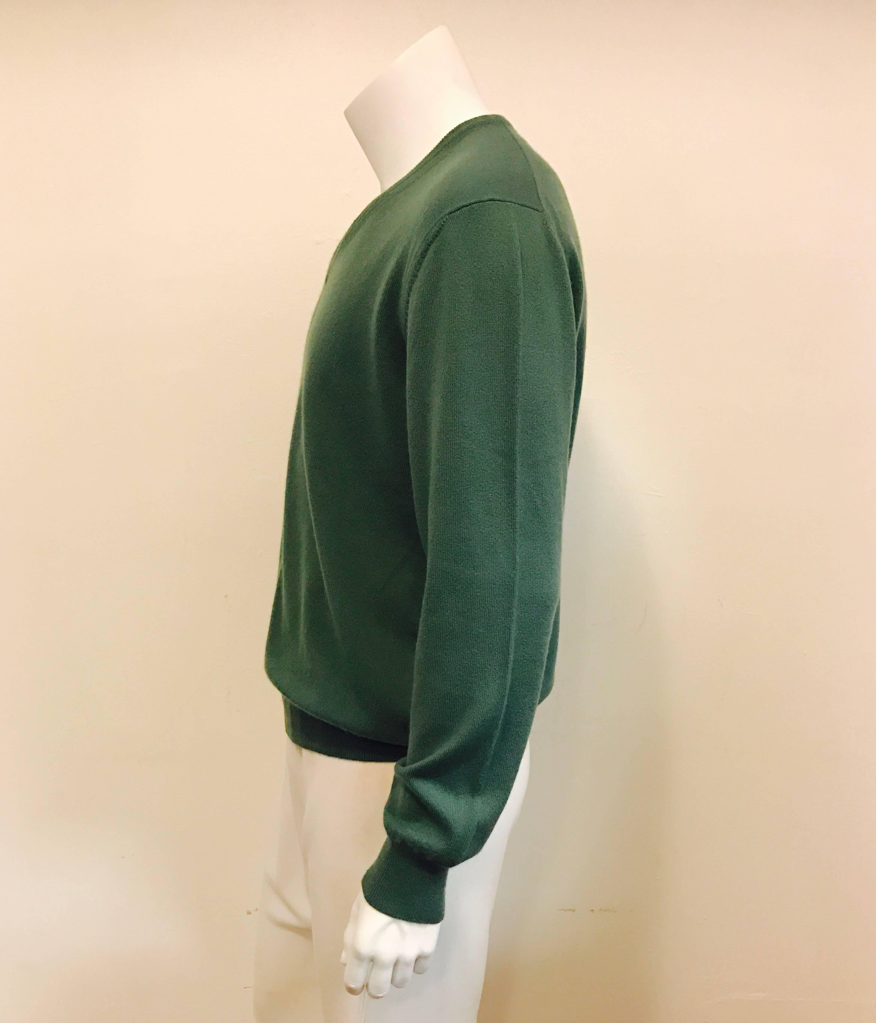 Wonderfully soft baby cashmere pullover in a soft teal, made in Italy.  V neck with welted cuff and hem.  Measures 48