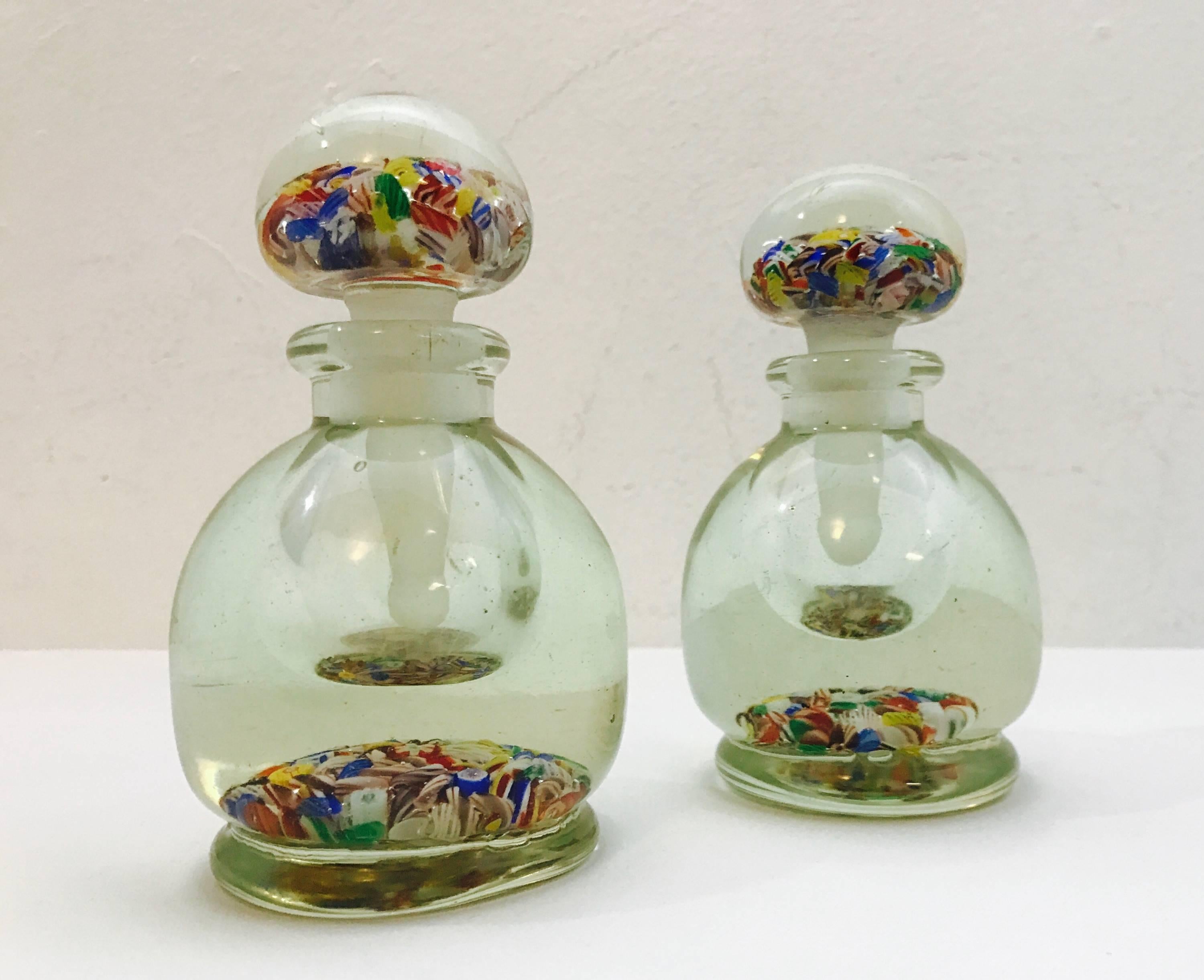 A wonderful vintage lidded bottle made in the style of Italian millefiore glass, which is an art form using rods of coloured glass that are cut into decorative shapes and encased in clear glass.  China created some excellent millefiore at the turn