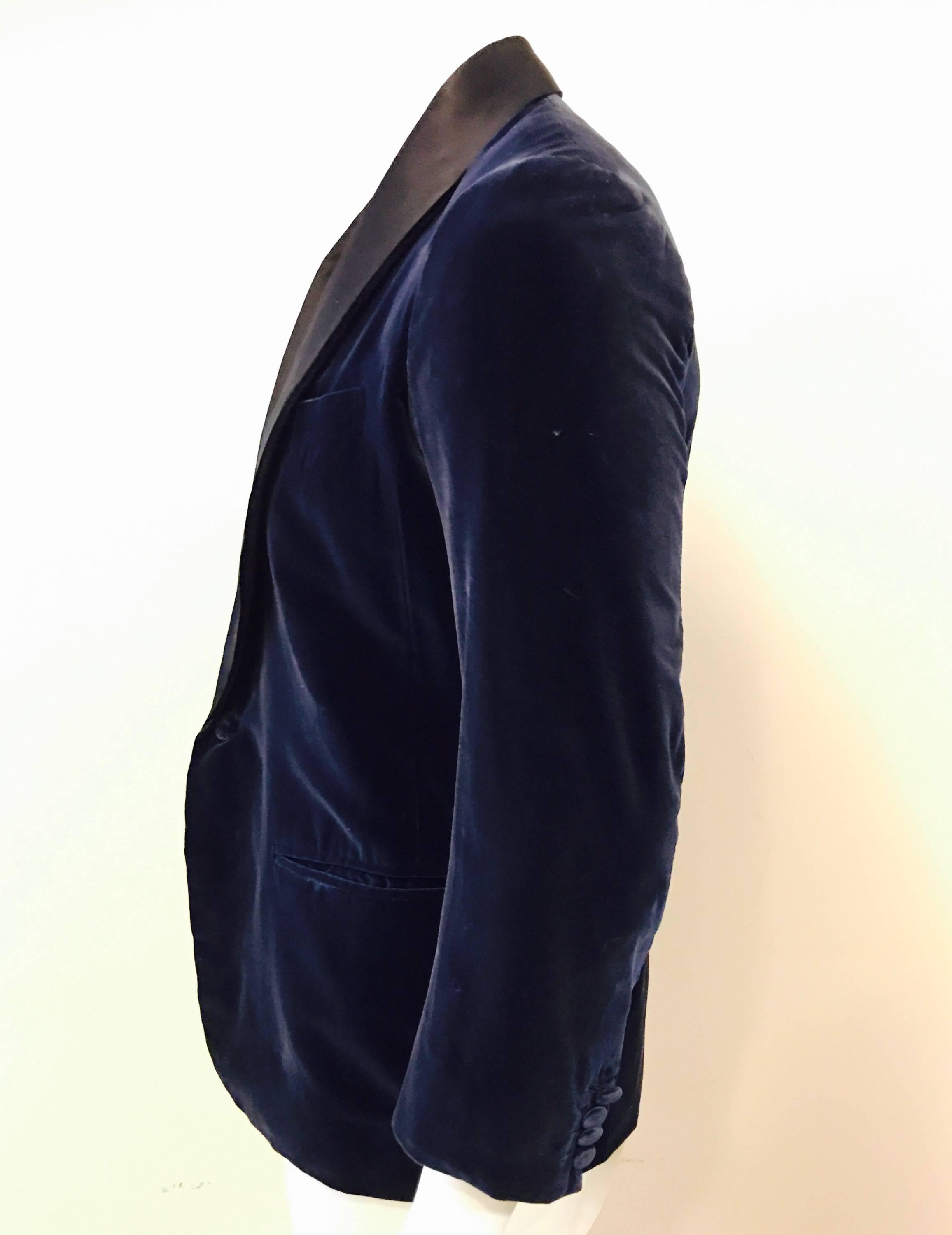 A fabulous vintage 1960's velvet smoking jacket made in Saville Row, London, by Anderson and Sheppard who have been in business since 1906.  Smooth cotton velvet, with a silk satin shawl collar in a sumptuous midnight blue.  One button close, four