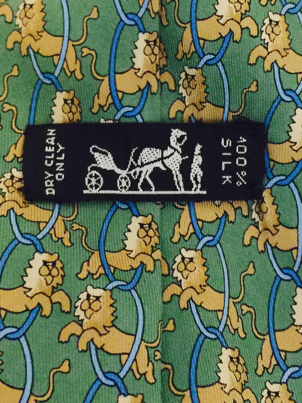 Men's Hermes vintage 1980's neck tie with whimsical lions jumping through chain hoops.  Sure to put a smile on your face during those difficult work days!