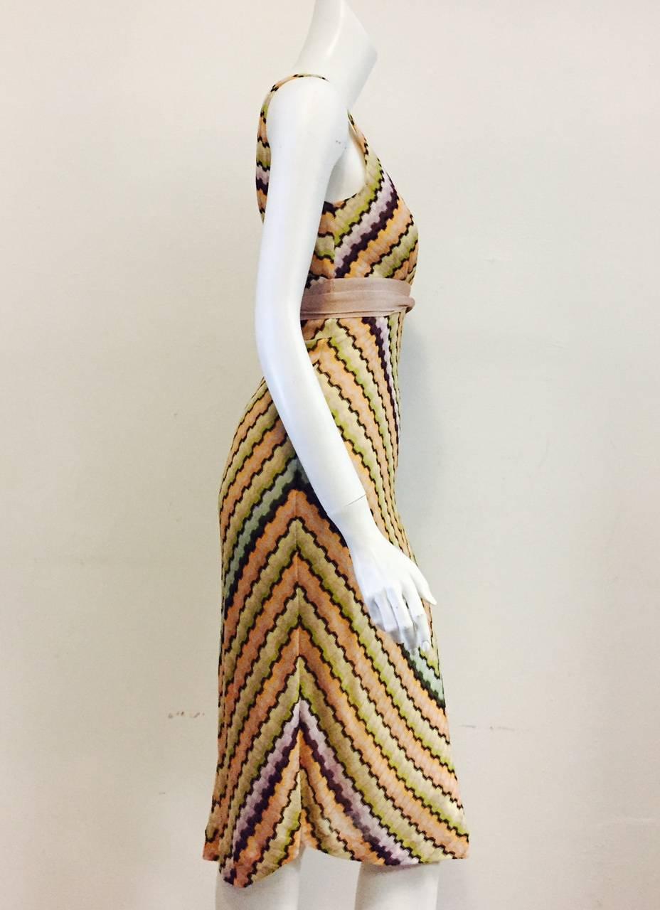 Missoni Multi Color Zig Zag Knit Dress is a must for connoisseurs of all things Missoni!  Perfect for travel, dress features longer knee length, V neckline, and sophisticated Italian design. Sleeveless construction and incorporated long tie complete
