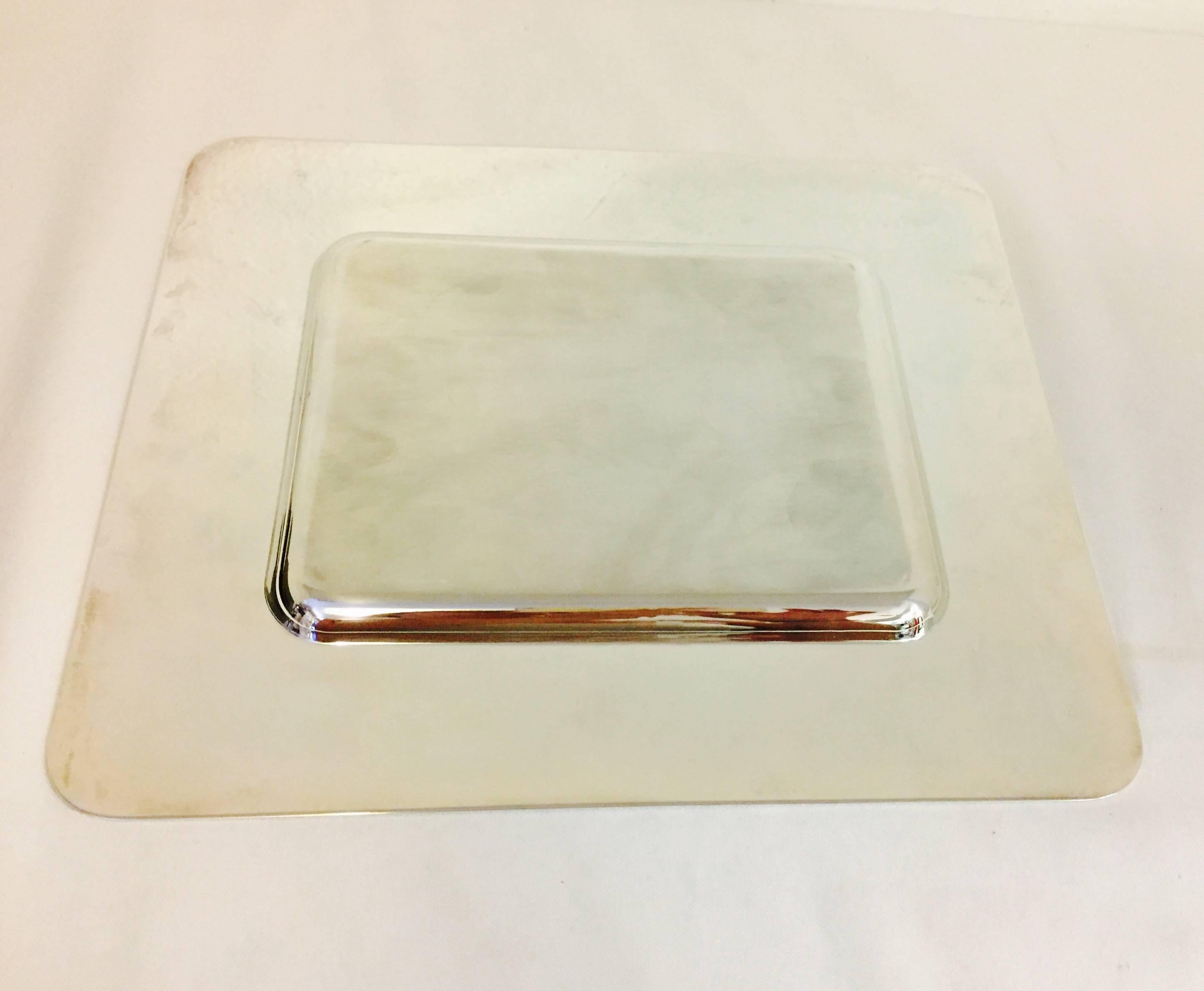 A silver plated Christofle dish or tray, or simply a beautiful display piece, with scrolls of acanthus leaves etched across the top and bottom.  Never used, and in the box (please note one end of the box has corner tears, see photos)  Measures 10