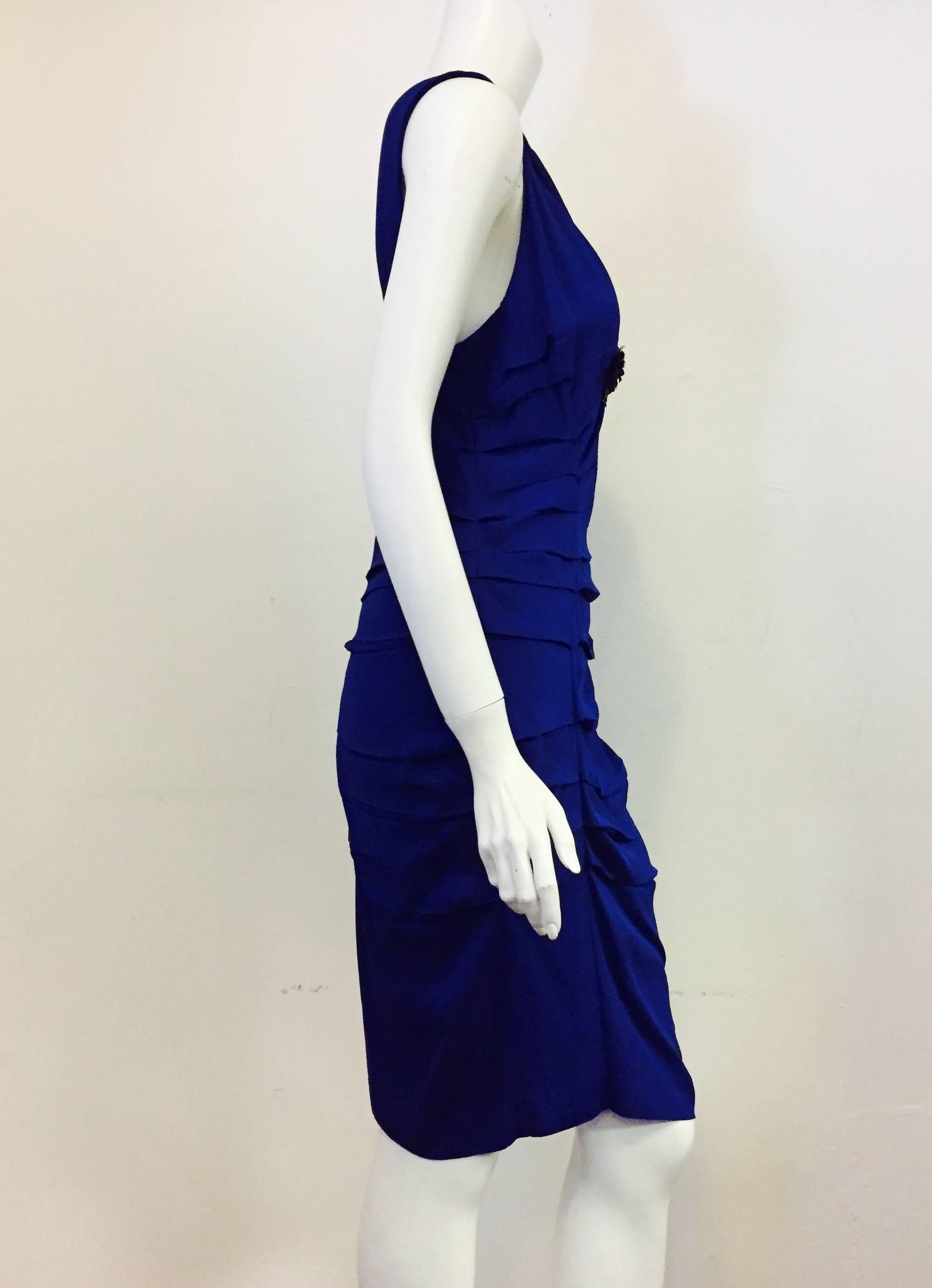 V neck draped silk dress with flowers below bust.  Color cobalt blue.  Ruched sides and flowing material make for a very sexy and comfortable dress!  Beautiful low back and front V neck make for a classic and yet flirty look for evening dinners,