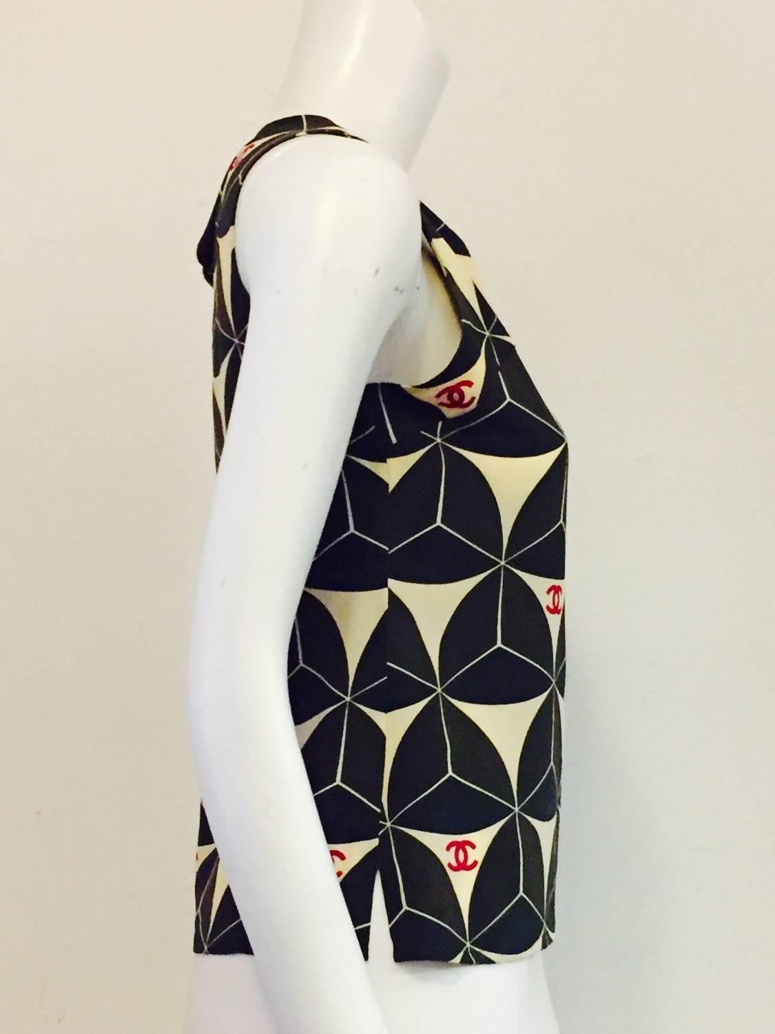 Chanel silk top with CC logo in Red on Black and Beige geometric design.  Always in style! Sleeveless camisole style top alone with skirt or slacks, under jacket or with black jeans and sweater!.