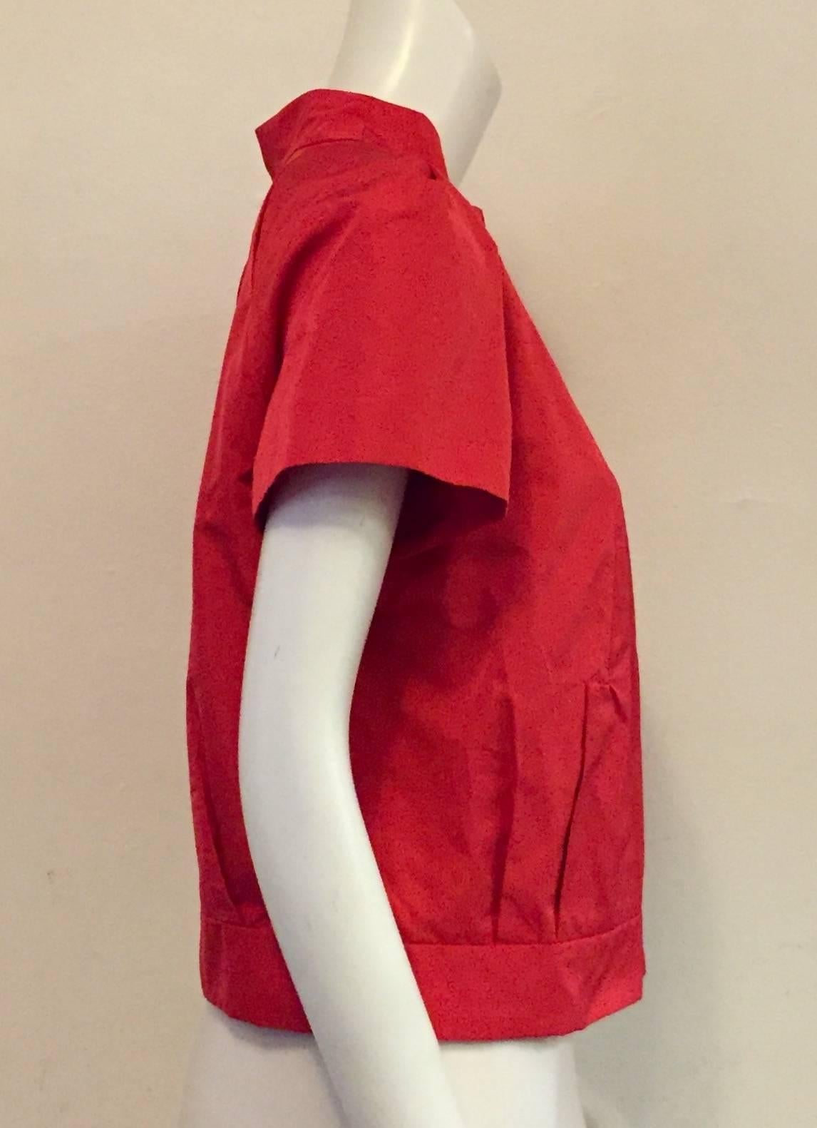 Red silk short sleeve jacket with zipper.  