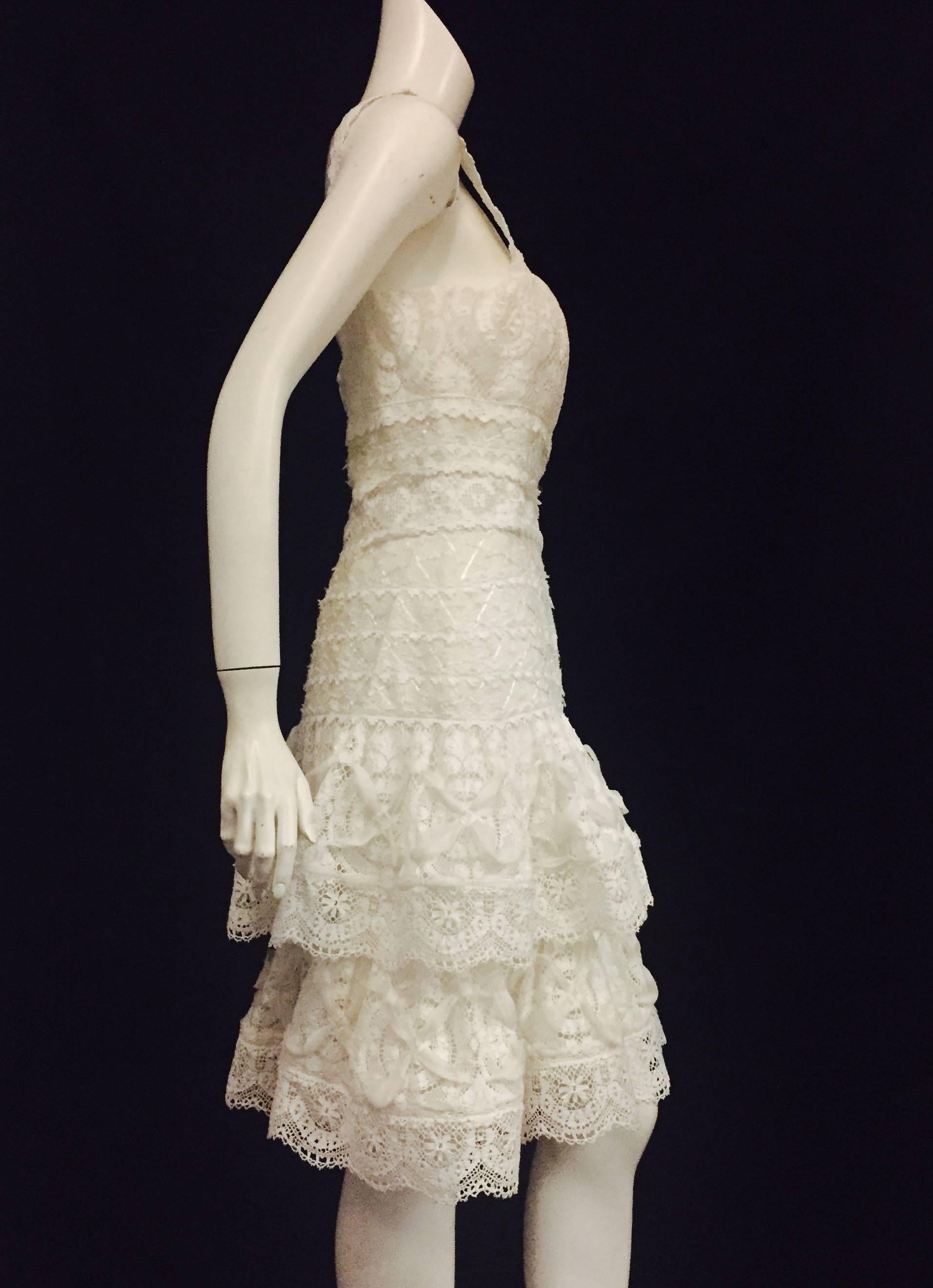 Romantically designed Oscar de la Renta dress in white lace.  Perfect flirty summer dress with shoulder straps.  Lace and ribbons throughout this delicate 3 tier ruffled knee-length dress. Enchanting Oscar de la Renta for an Enchanted Evening. 