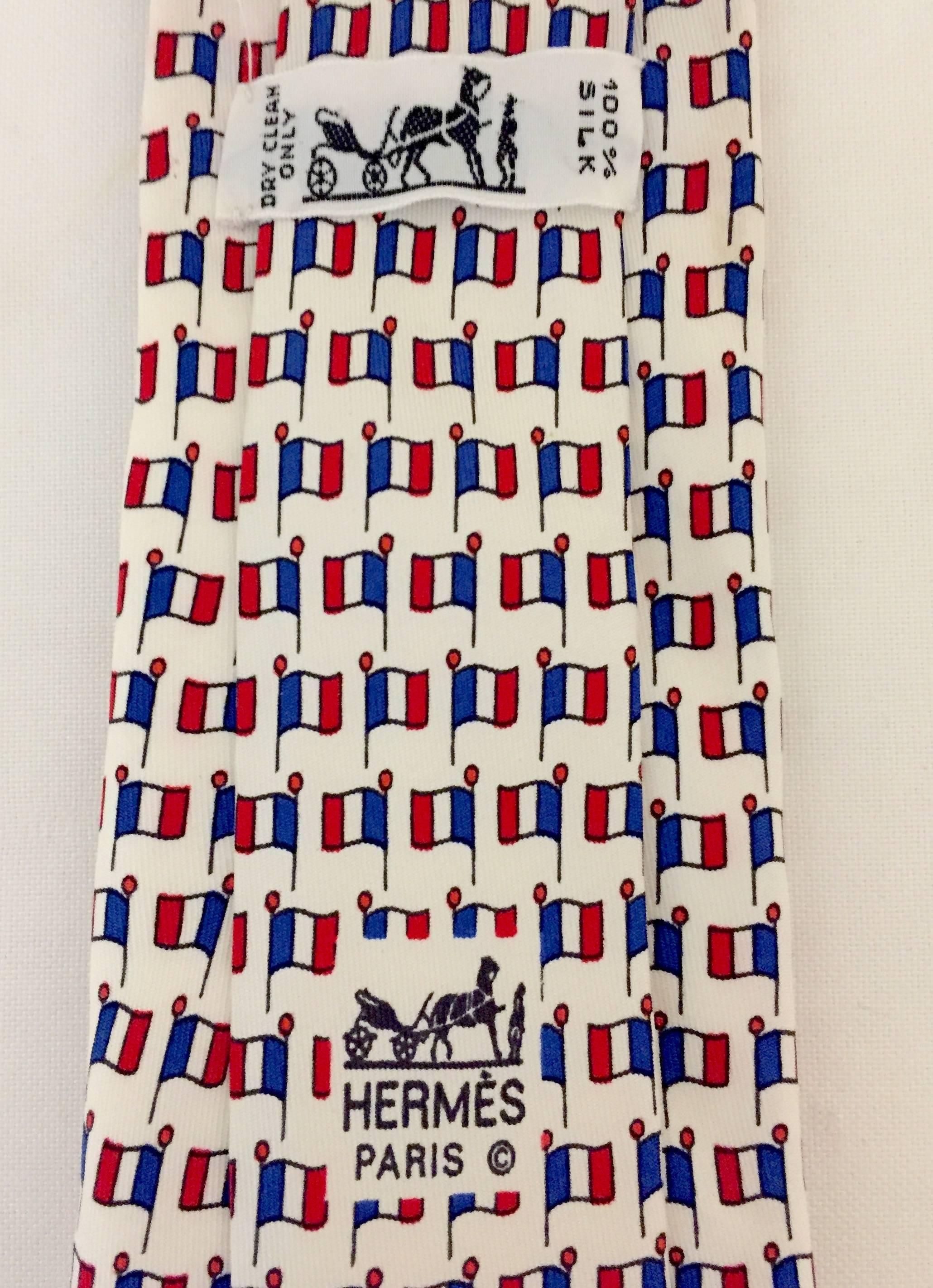 This 1980's silk necktie from Hermes is a classic, representing the Democratic Republic of France Tricolore Flag.  A great addition for the collector or French aficionado.   Bon Voyage!