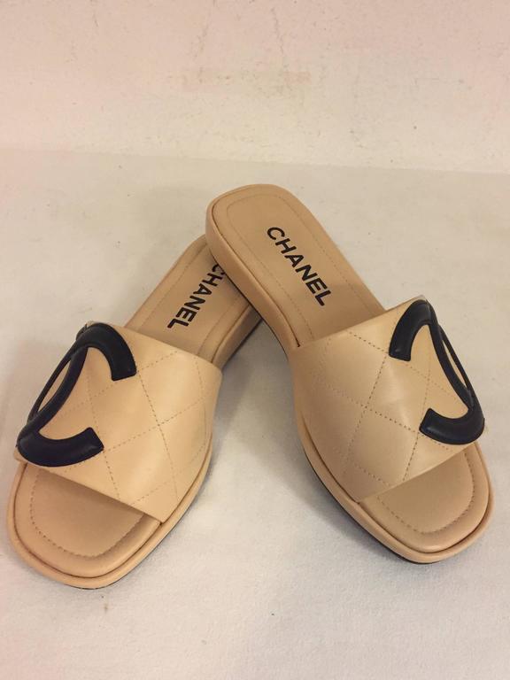 Chanel Cambon Beige Quilted Slides with Black Interlocking CC in Black at  1stDibs