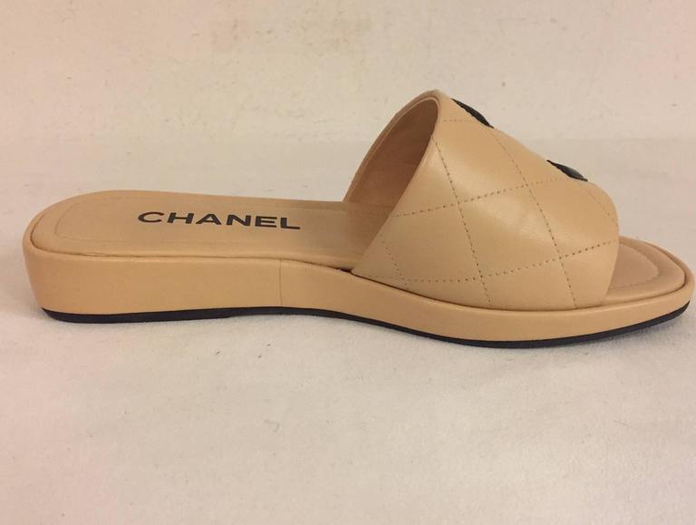 Chanel Cambon Beige Quilted Slides with Black Interlocking CC in Black at  1stDibs