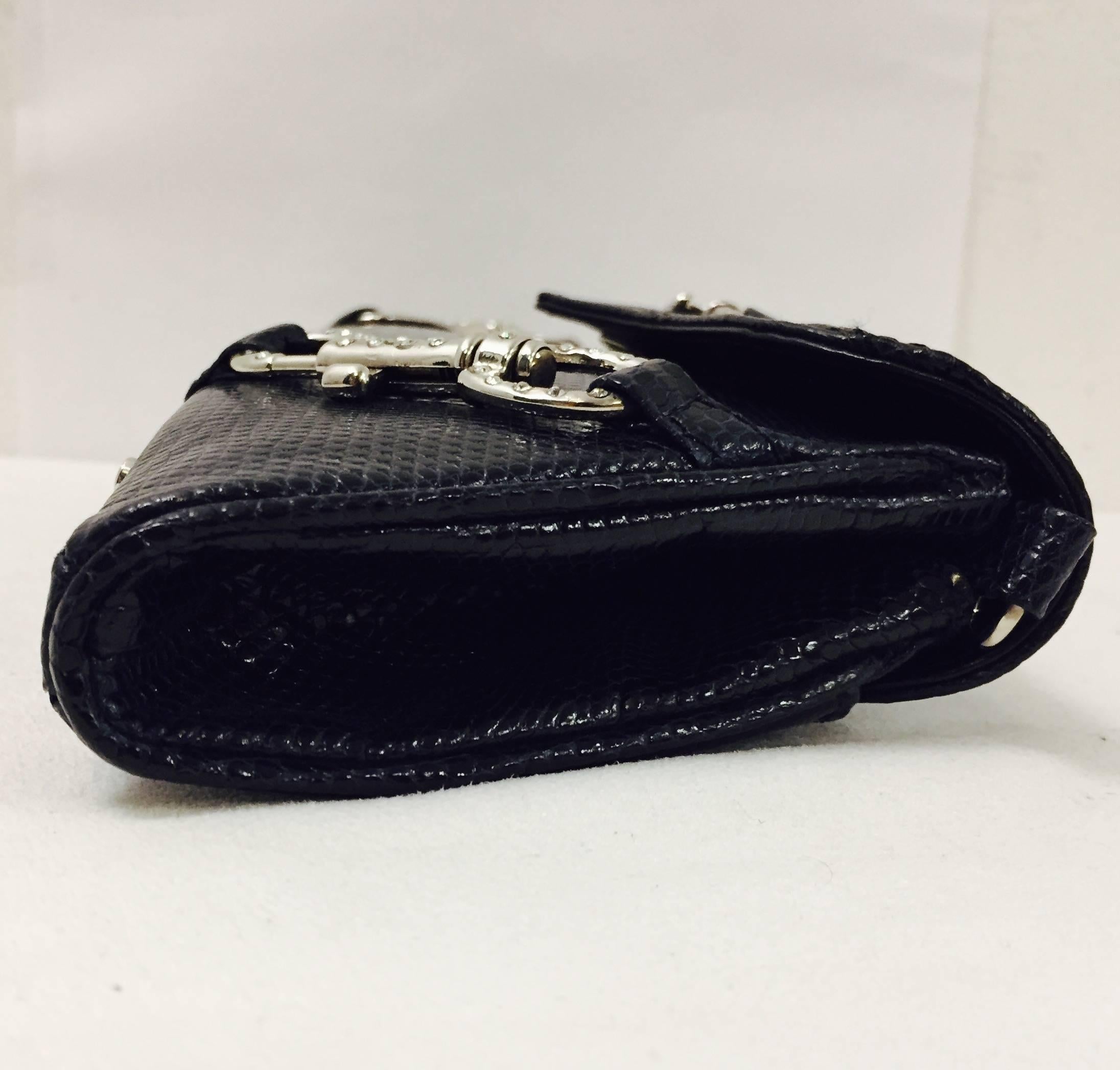Authentic and lovely Lana Marks vintage lizard handbag/shoulder bag by Lana of London who later became well known as Lana Marks. The bag has an outside flap pocket that securely snaps for easy access. There are two handles that will comfortably fit