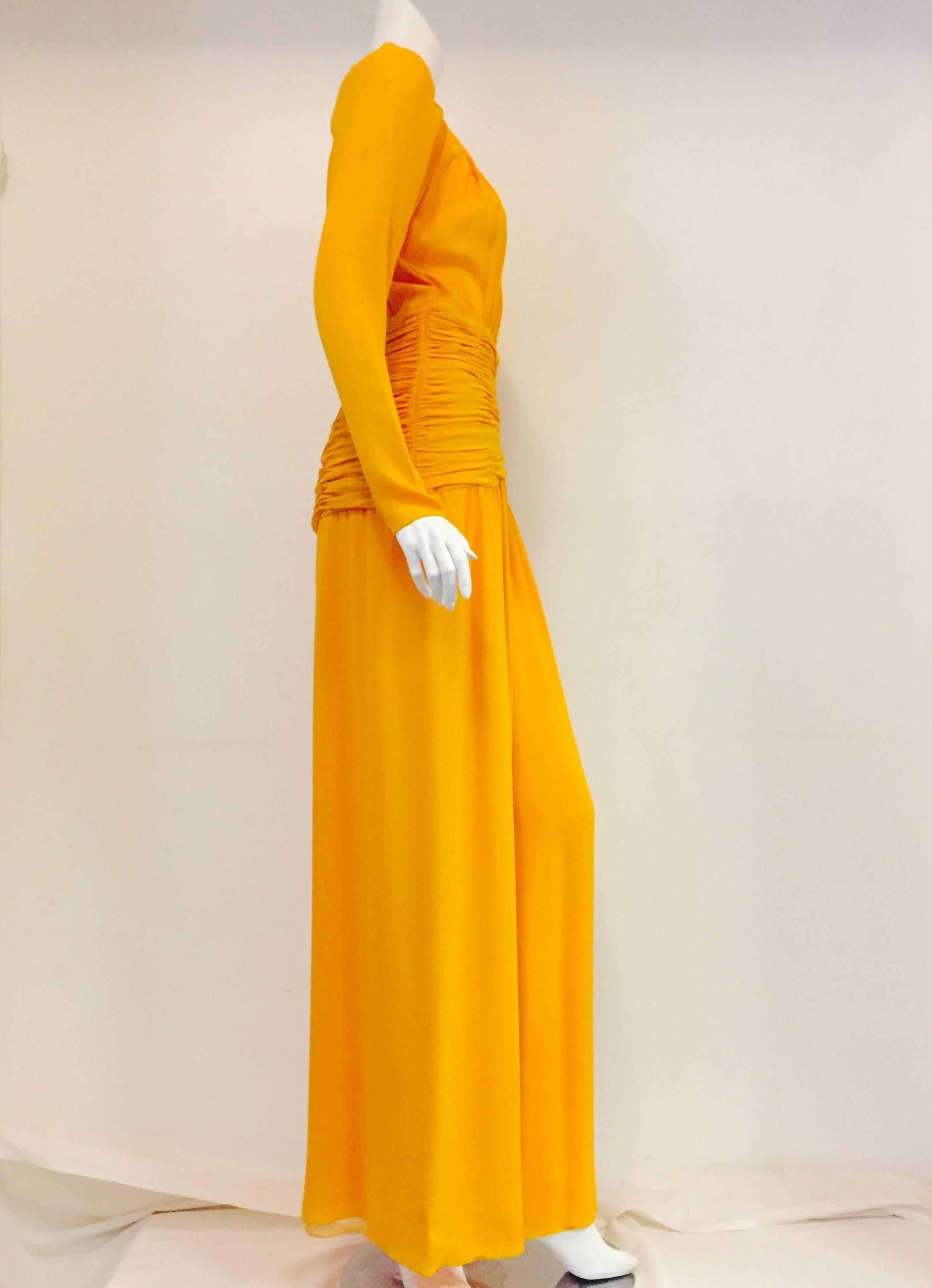 This vintage yet modern Mango Oscar de la Renta jumpsuit is fully lined with layers of chiffon.  Features sophisticated one-piece 