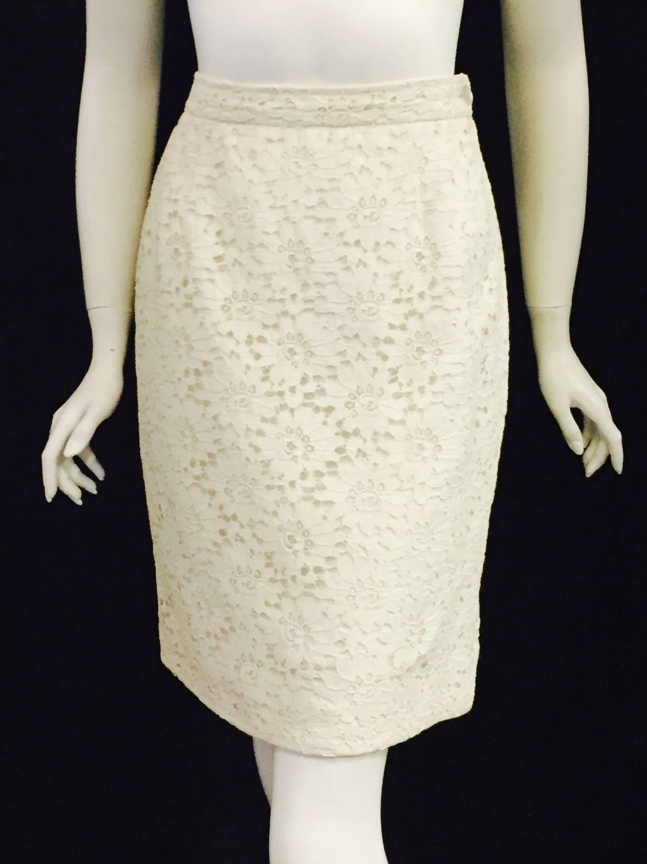 Emanuel Ungaro's Ivory lace skirt features classic pencil silhouette and knee length. The incredible flower pattern lace is reminiscent of 70's wedding dresses.   An awesome lace flower design skirt that can be dressed up with a sequined top or more
