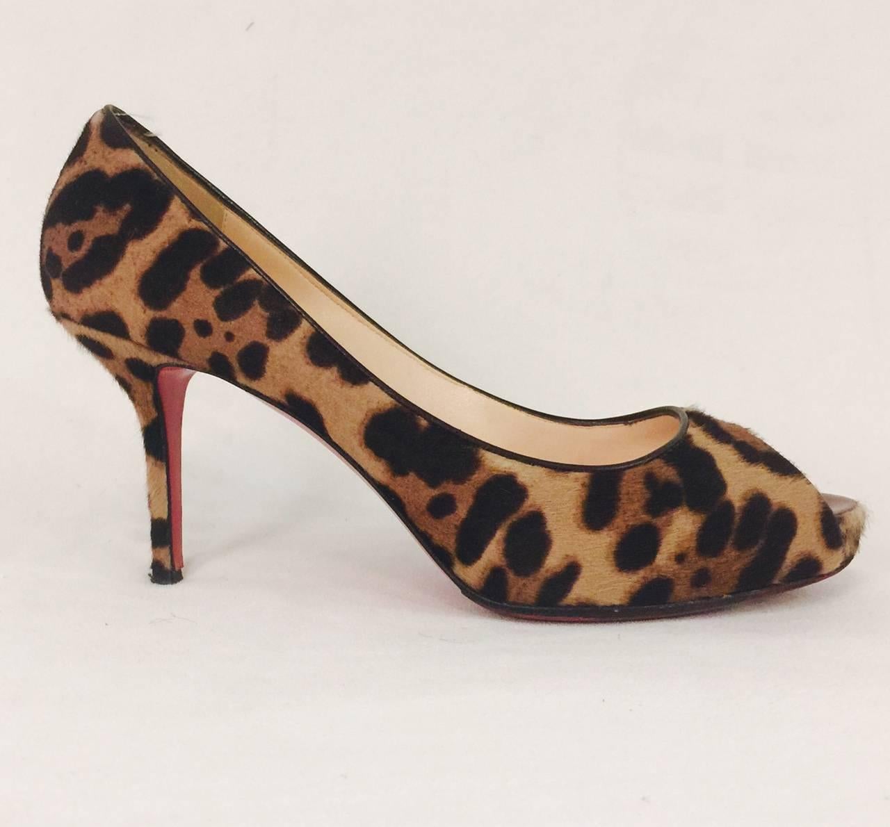 Louboutin's trademark glossy red soles give an instant stamp of fashion chic and fun.  Christian Louboutin Leopard Print Pony Hair Flo 120 Pumps are perfect for you! The printed pony hair combined with a dark red patent leather trim at the peep toe